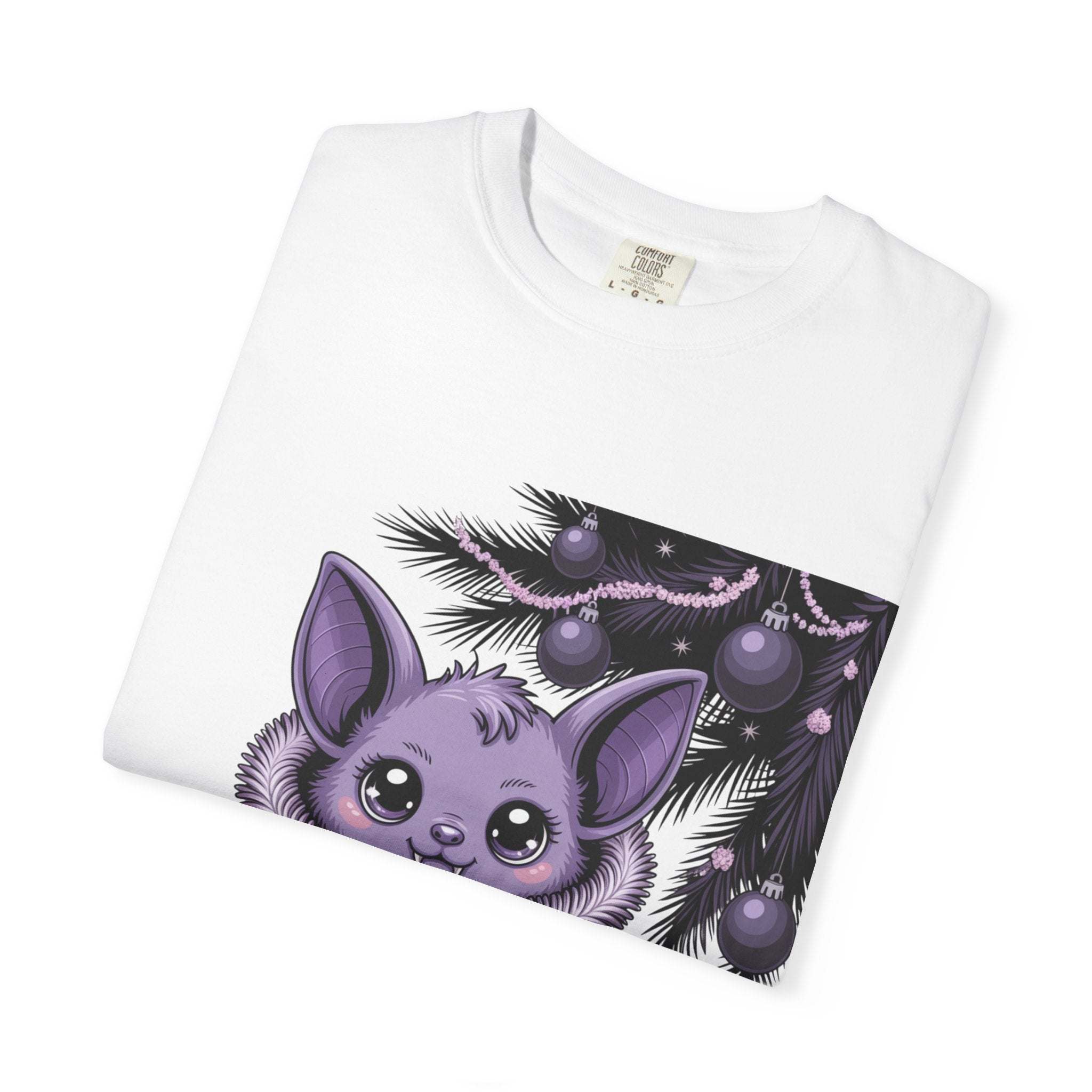 Folded white Gothmas Bat T-Shirt featuring a cute purple bat and black festive greenery with ornaments design