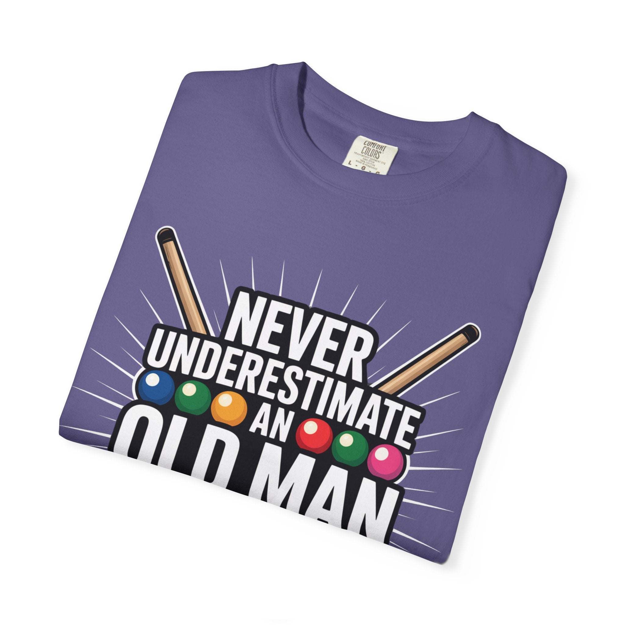 Purple t-shirt with pool cues and colorful balls graphic and text on a white background