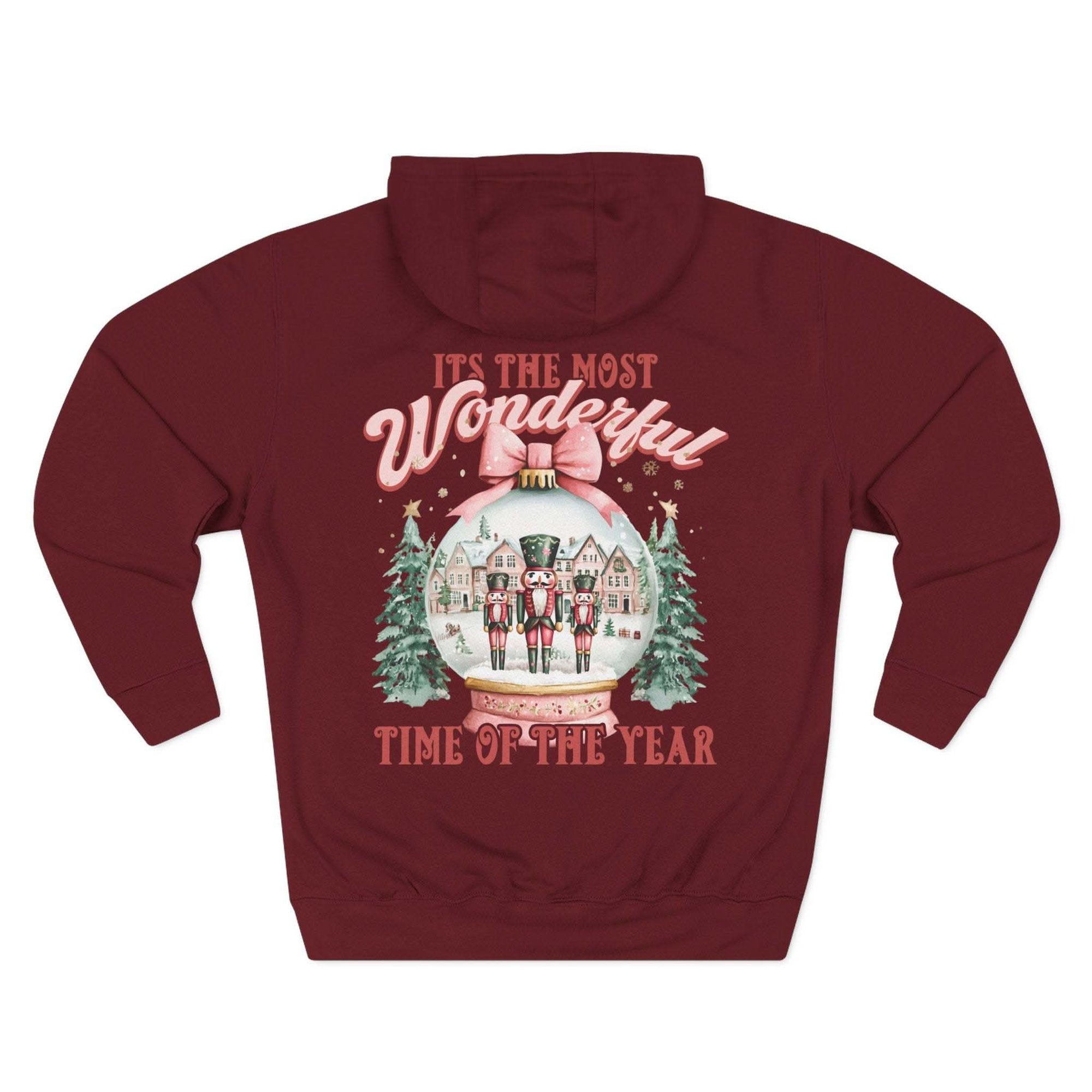Cozy fleece hoodie with vintage preppy pink snow globe holiday design and adjustable hood