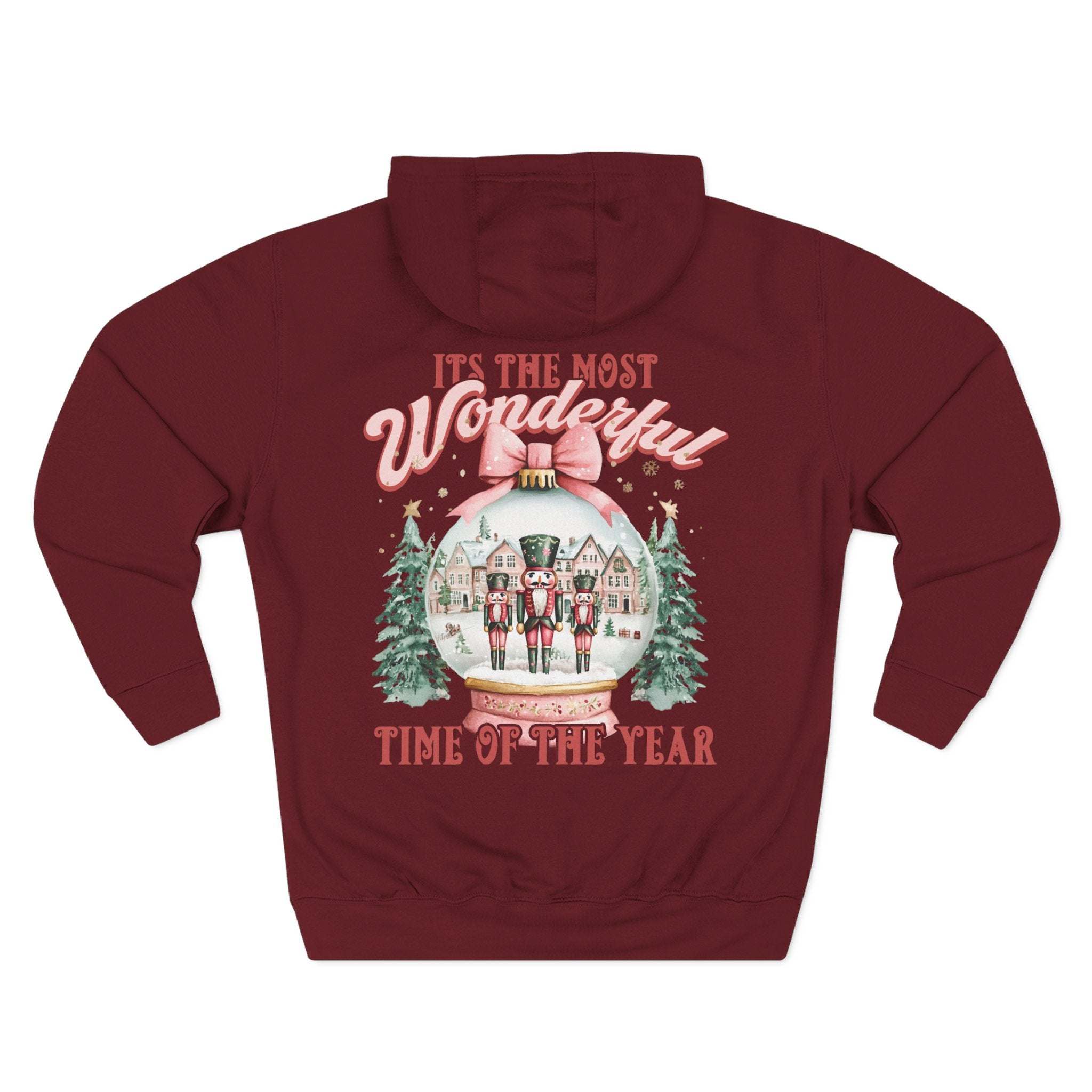 Cozy fleece hoodie with vintage preppy pink snow globe holiday design and adjustable hood