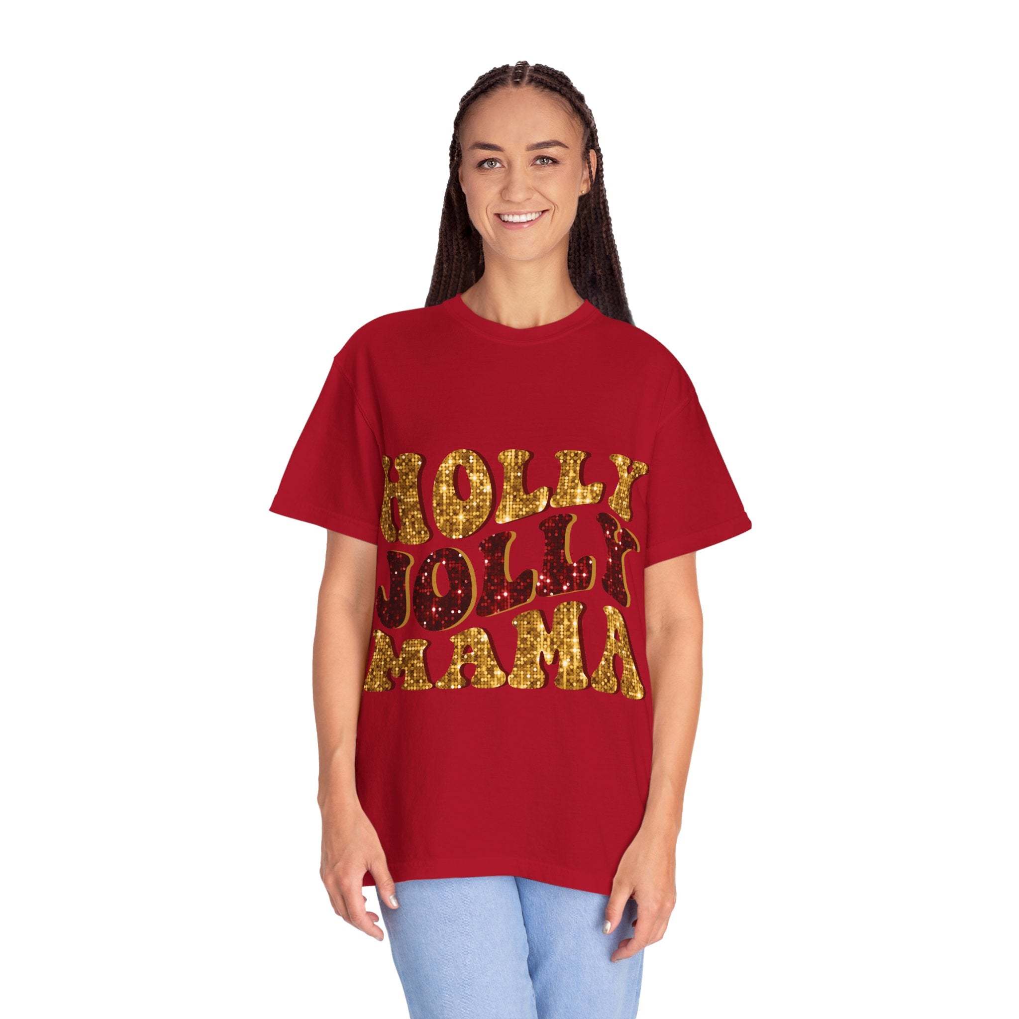 Woman wearing red Faux Glitter Holly Jolly Mama t-shirt with gold glitter text and blue jeans