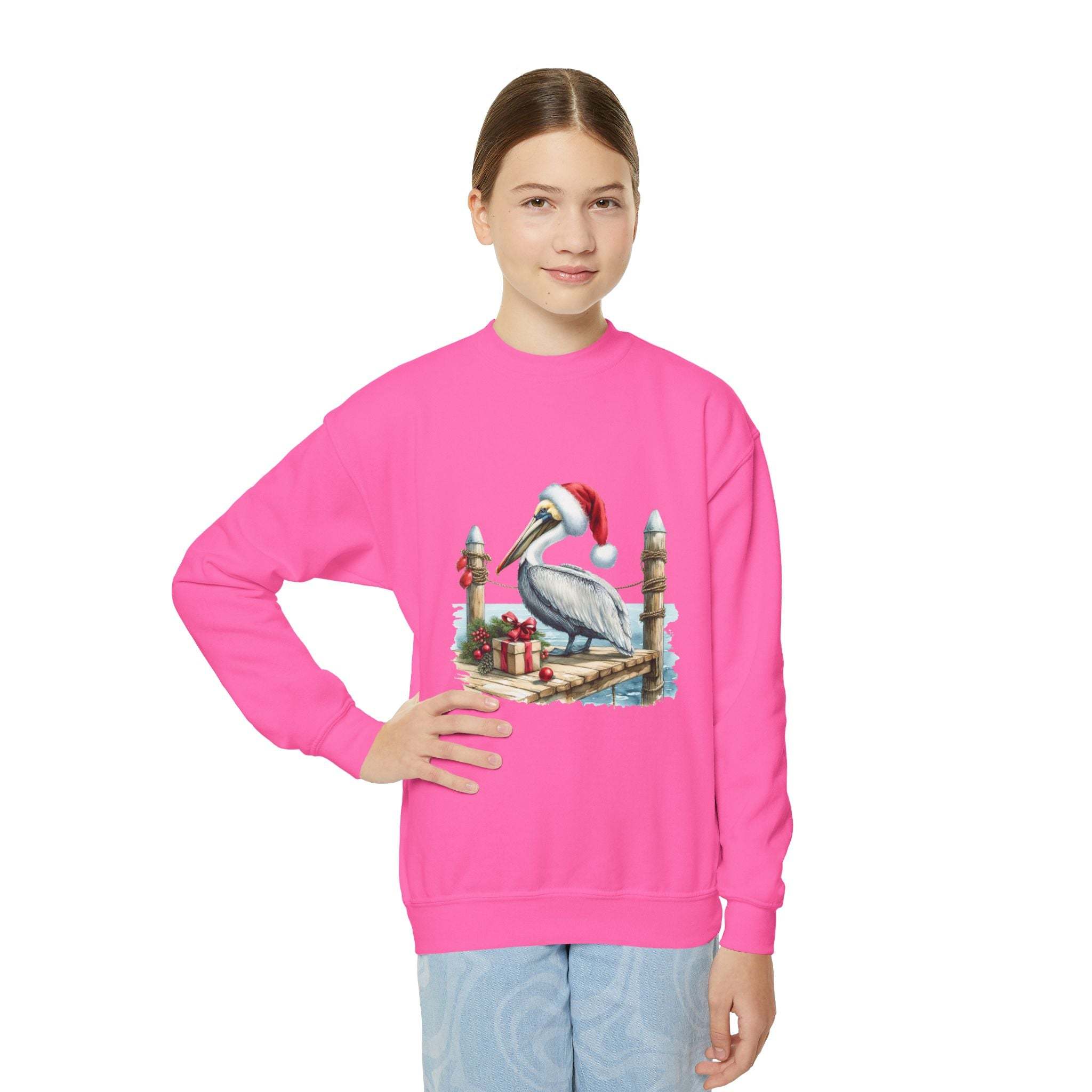 Youth crewneck sweatshirt with embroidered pelican wearing Santa hat on pink fabric