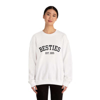 Person wearing a white sweatshirt with 'BESTIES EST. 2025' text on a white background