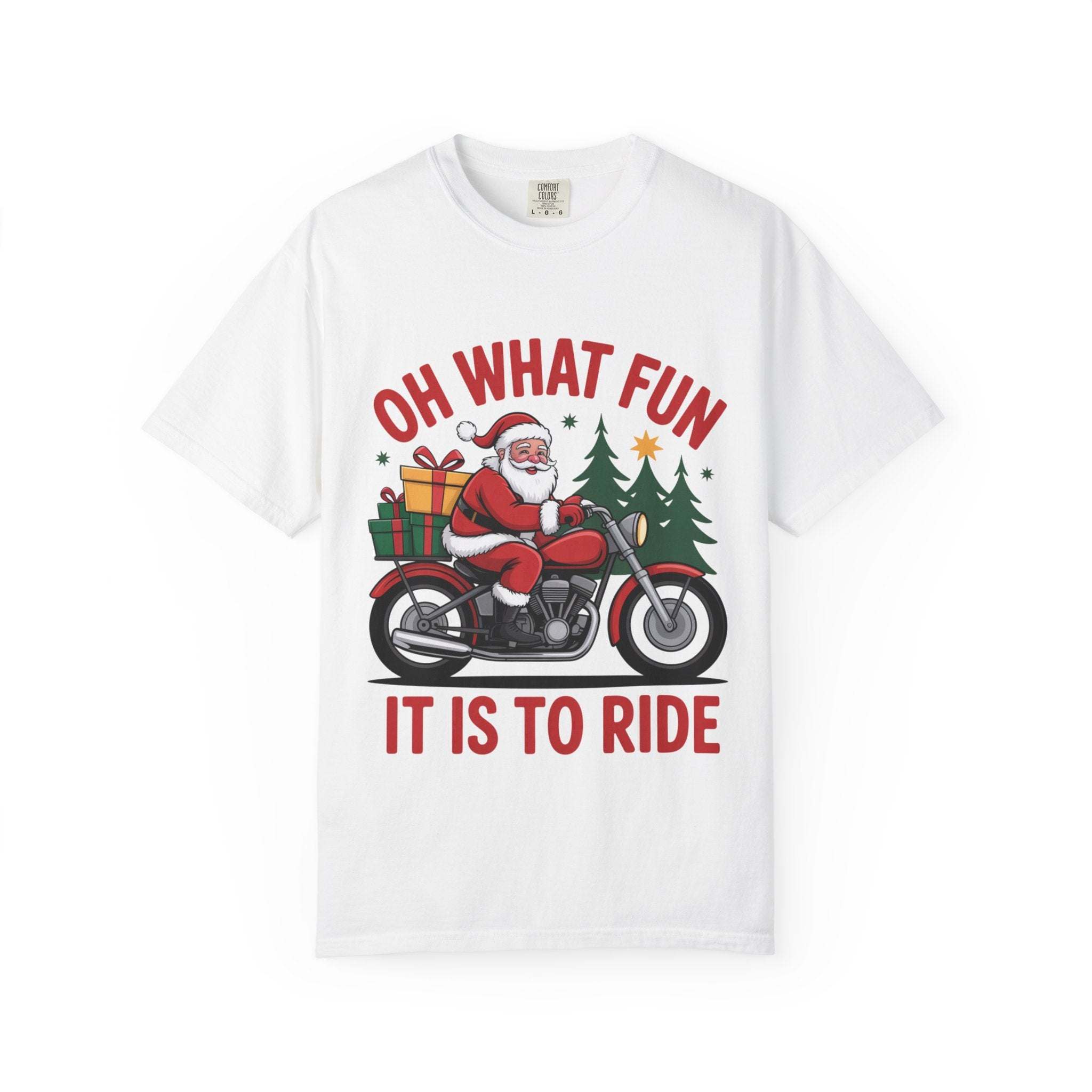 White t-shirt featuring Santa on a motorcycle with holiday gifts and trees, captioned "Oh What Fun It Is To Ride"
