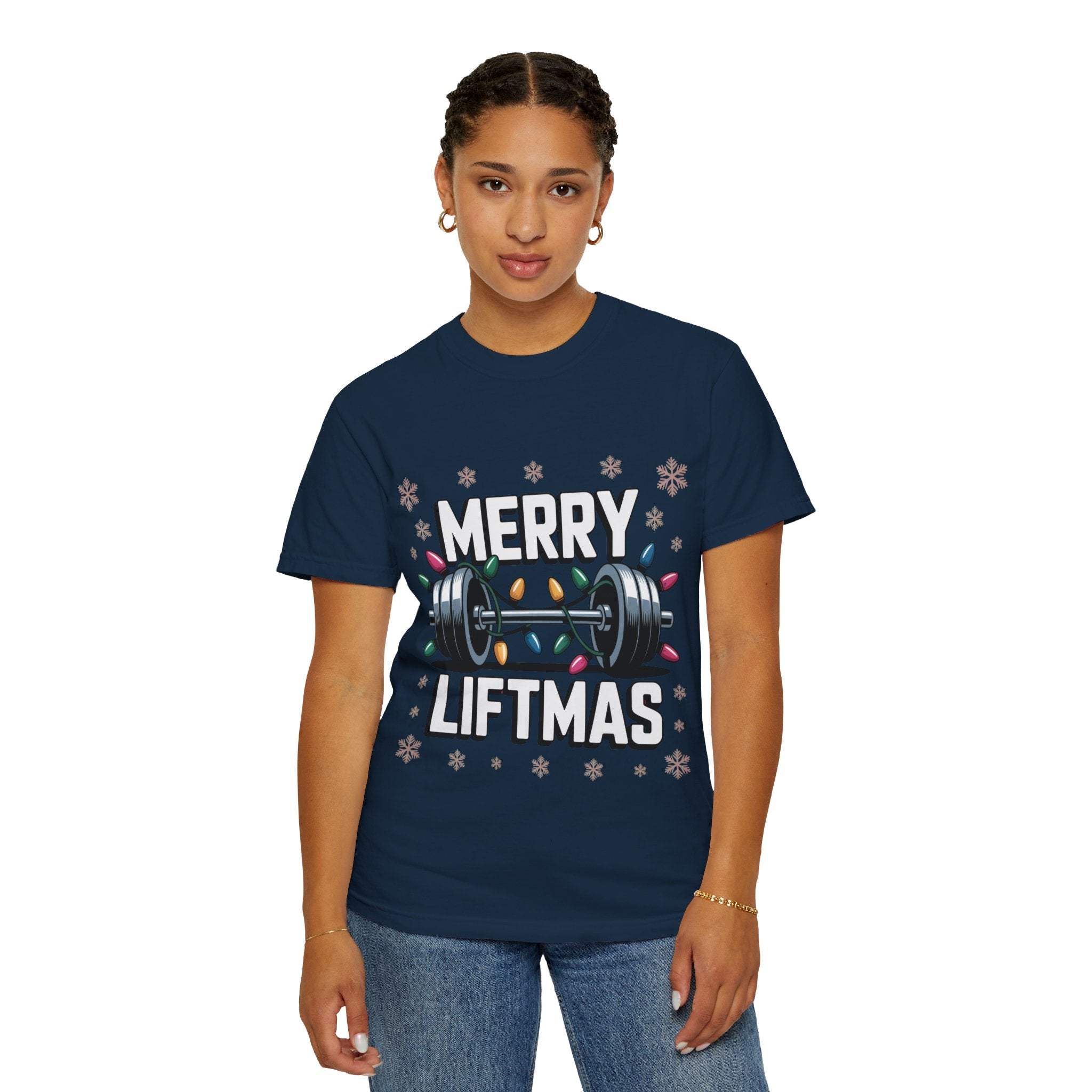 Woman wearing navy Christmas Workout T-shirt with Merry Liftmas design and weightlifting graphic