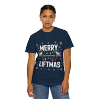 Woman wearing navy Christmas Workout T-shirt with Merry Liftmas design and weightlifting graphic