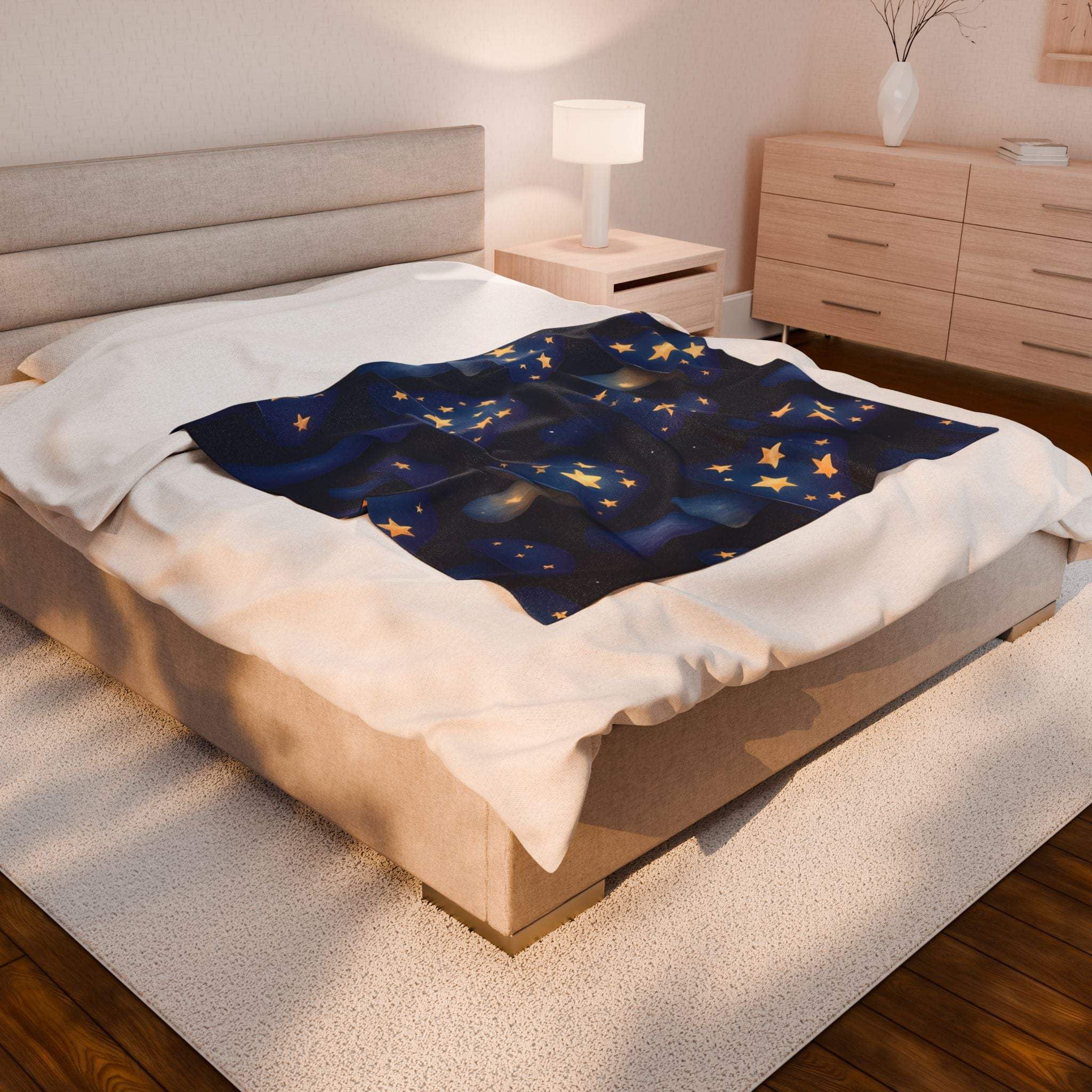 Plush blanket with whimsical mushrooms and glowing stars on bed in cozy bedroom setting