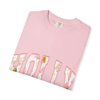 Pink Varsity Holly Jolly T-shirt with festive design, garment-dyed cotton, unisex relaxed fit