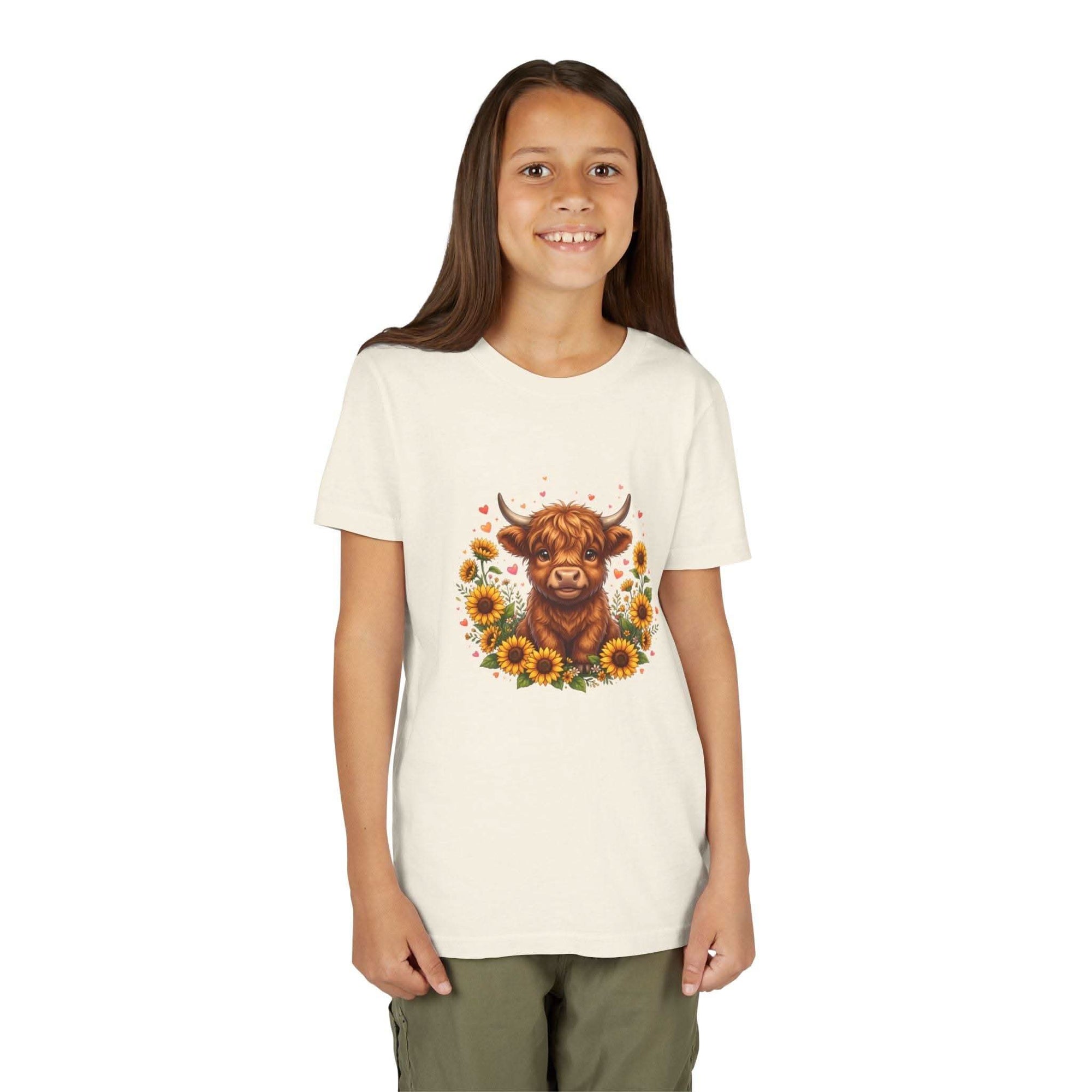 Youth tee featuring Highland cow with sunflowers design on soft cotton fabric