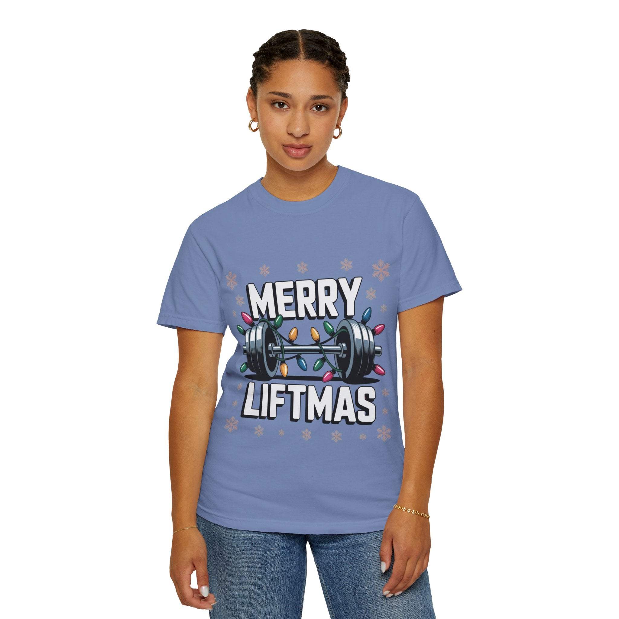Woman wearing blue Christmas Workout T-shirt with Merry Liftmas barbell design