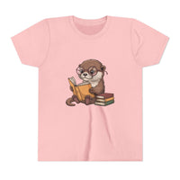Pink t-shirt with an otter reading a book graphic on a white background