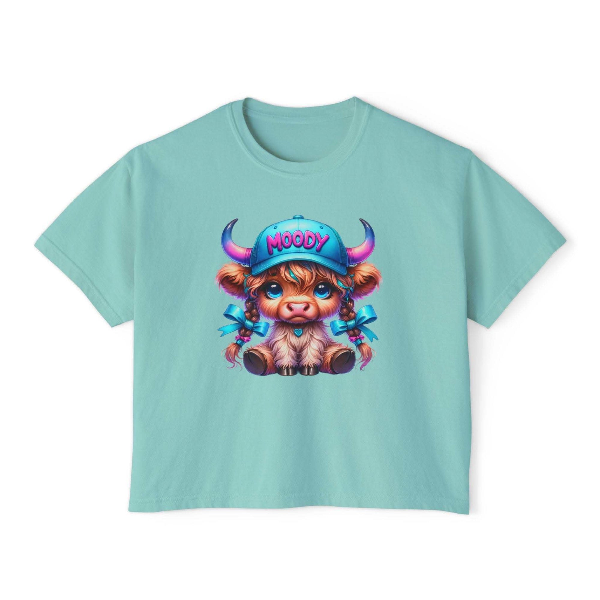 Women's boxy tee with moody girl highland cow graphic in blue pigment dye cotton