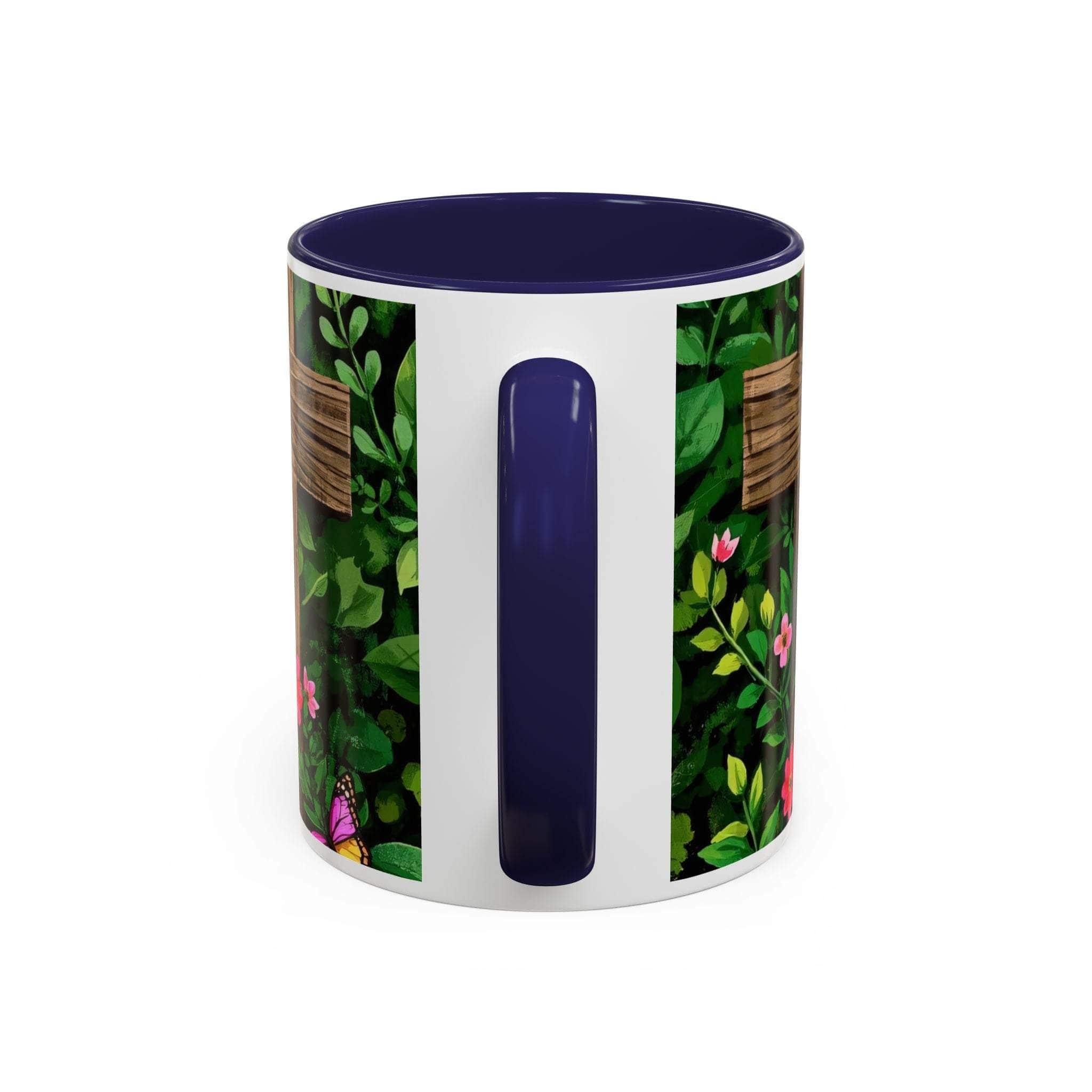 Mug with floral design and blue handle on a white background