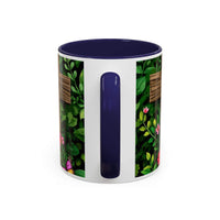 Mug with floral design and blue handle on a white background