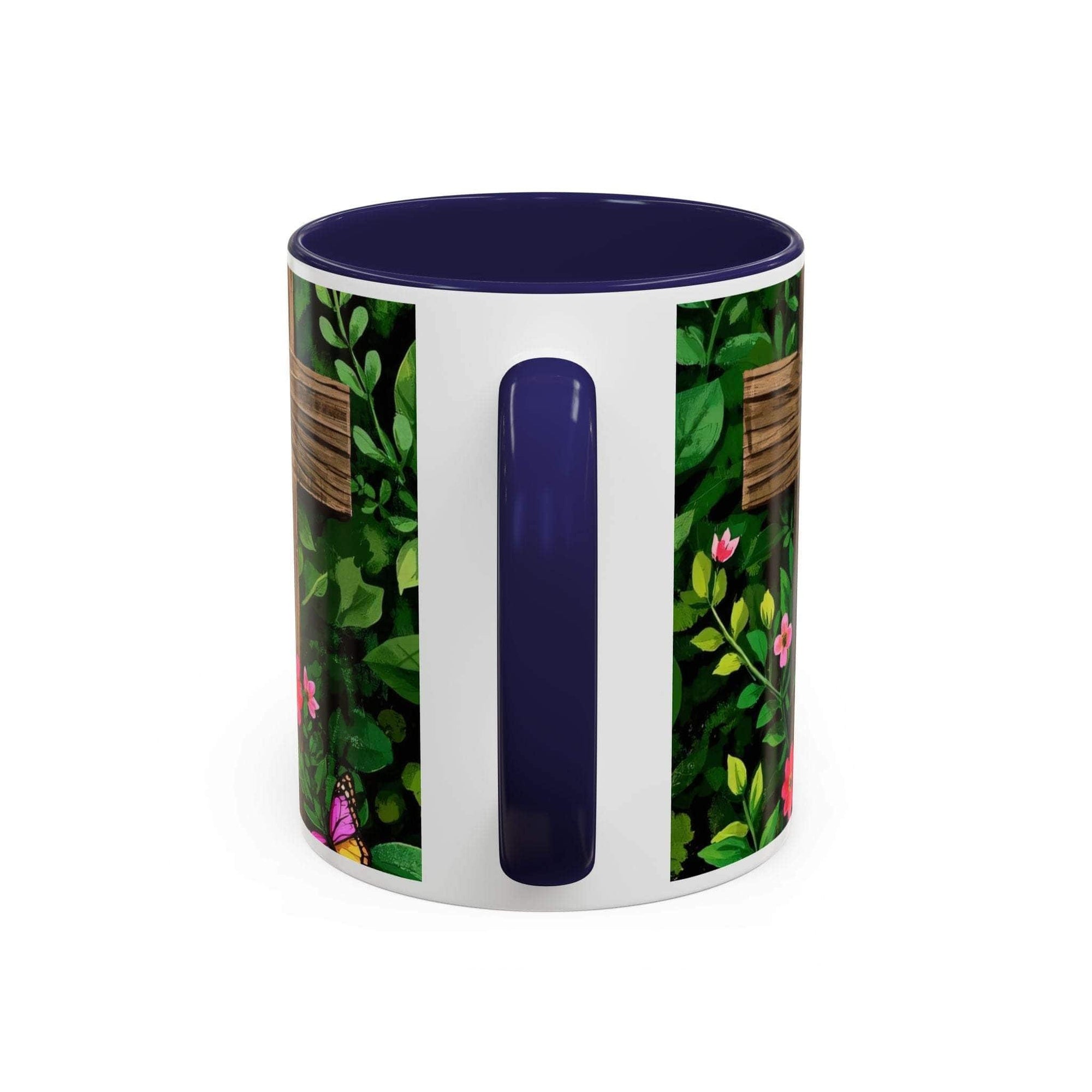 Mug with floral design and blue handle on a white background