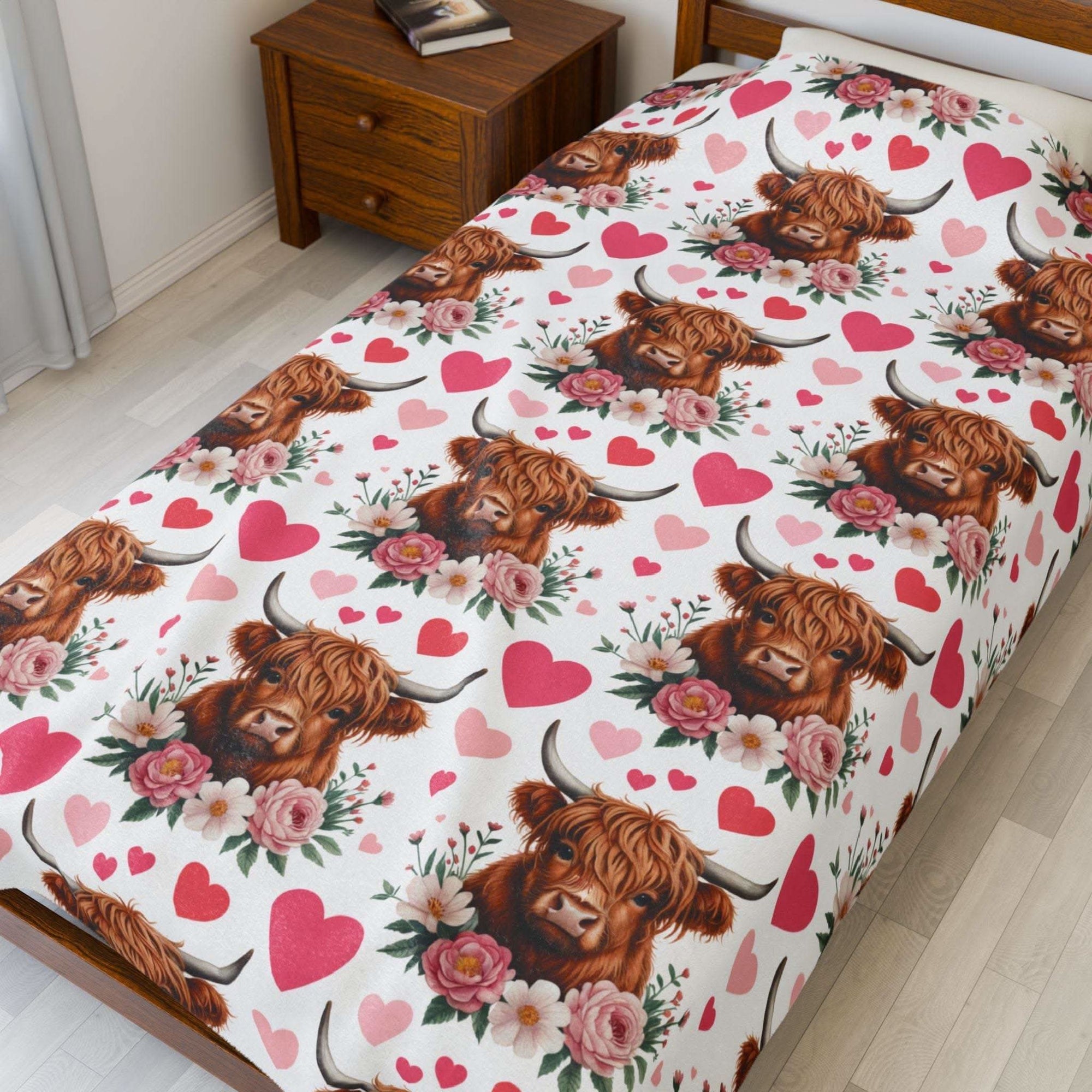 Velveteen plush blanket with floral Valentine design featuring a Highland cow on soft fabric