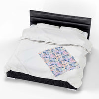 Coastal Cowgirl plush blanket with beach and horse design on bed