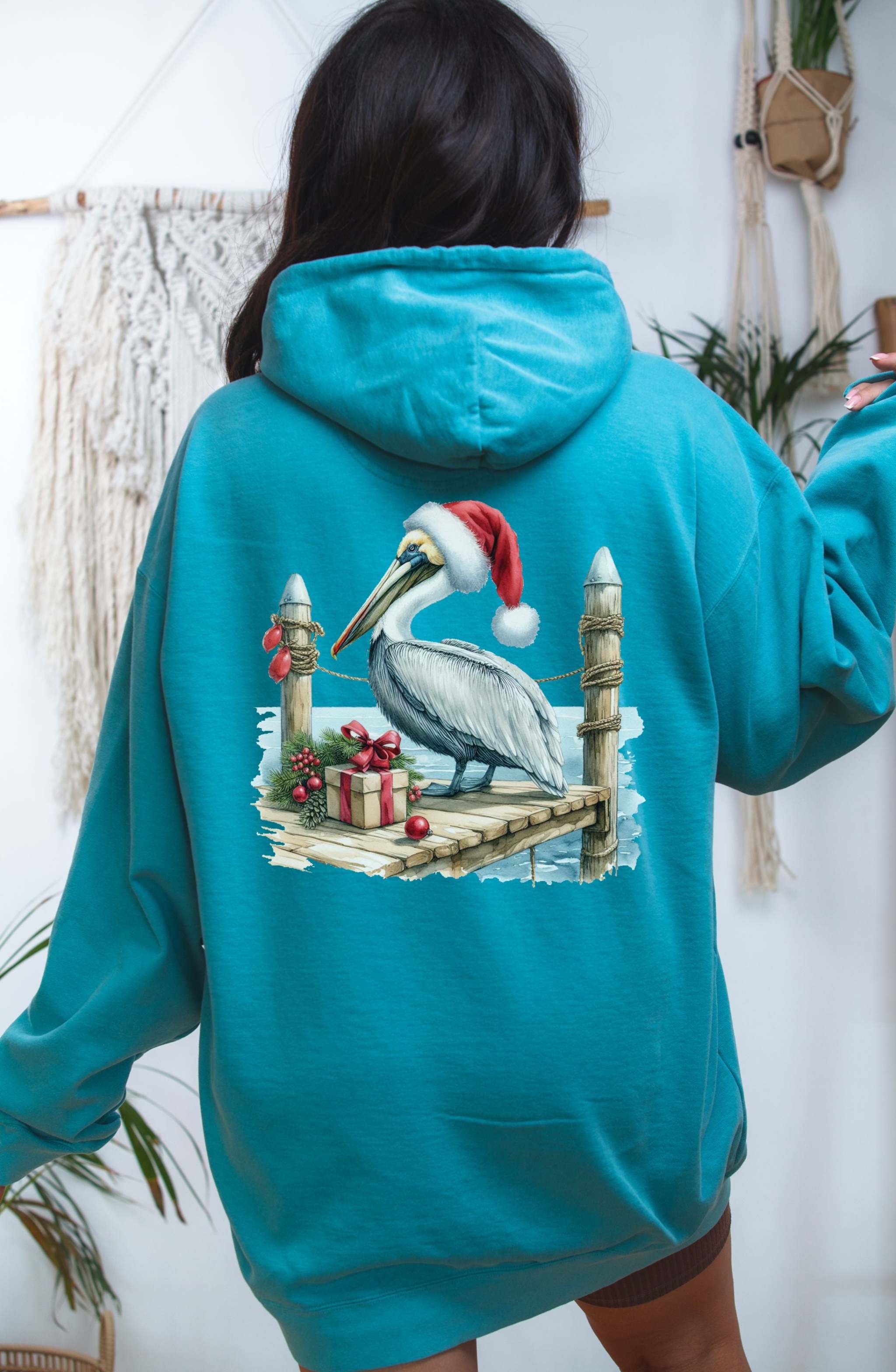 True Navy hoodie featuring a pelican in a Santa hat design from Printify, perfect for cozy beachwear
