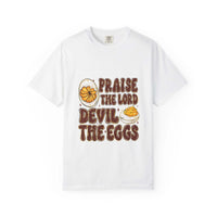 White cotton t-shirt featuring 'Praise the Lord, Devil the Eggs' design, perfect for Easter and Christian apparel.