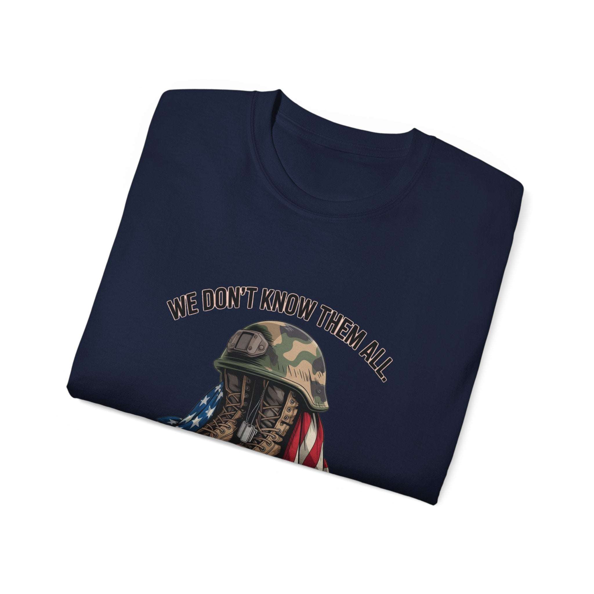 Unisex T-shirt with veteran tribute graphic and "We Don’t Know Them All But We Owe Them All" text on navy blue cotton fabric