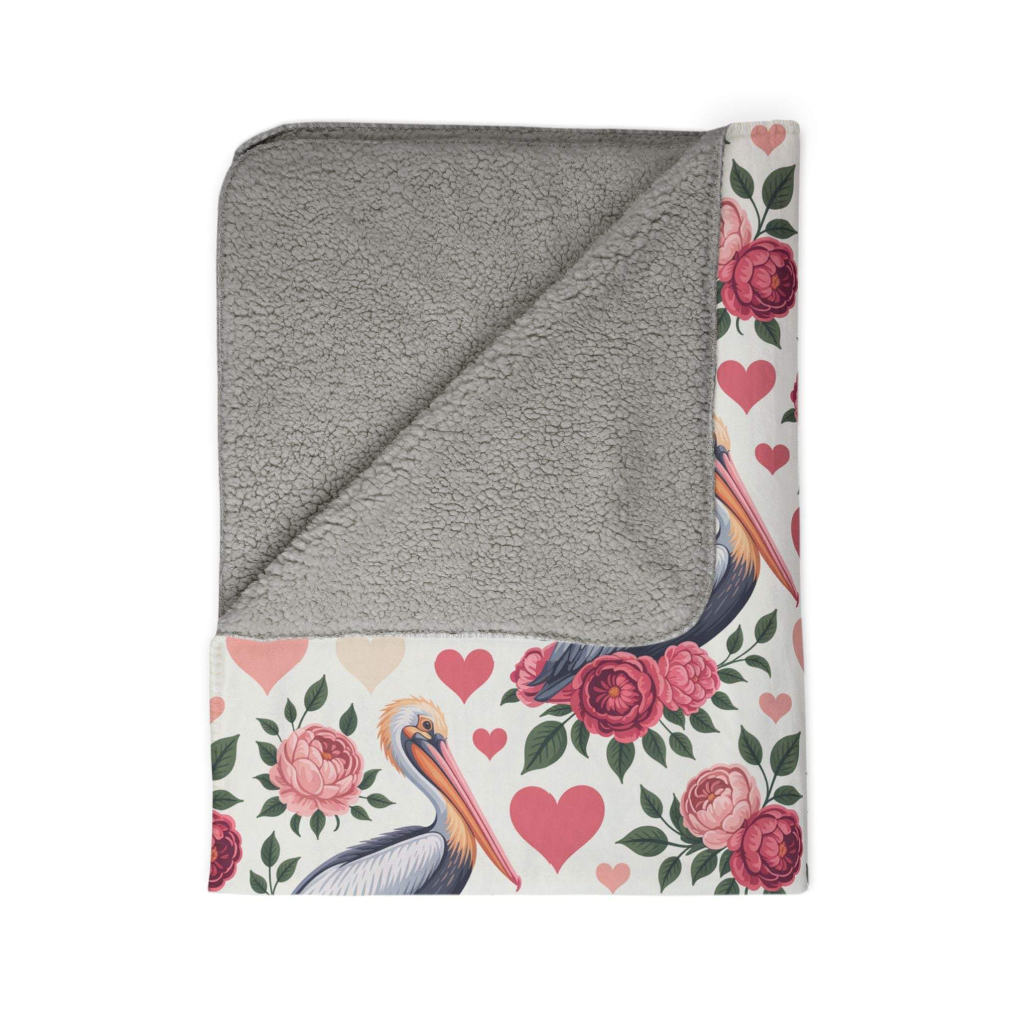 Soft fleece blanket with floral pelican design and plush Sherpa lining for cozy beach-inspired warmth