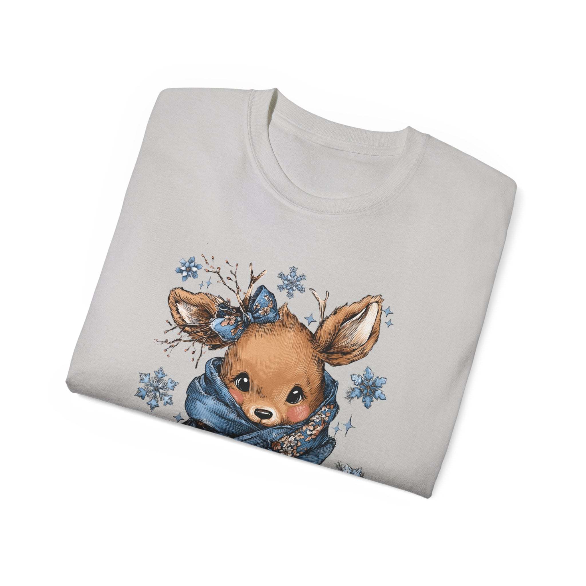 Folded white t-shirt with retro patchwork reindeer design and blue scarf illustration