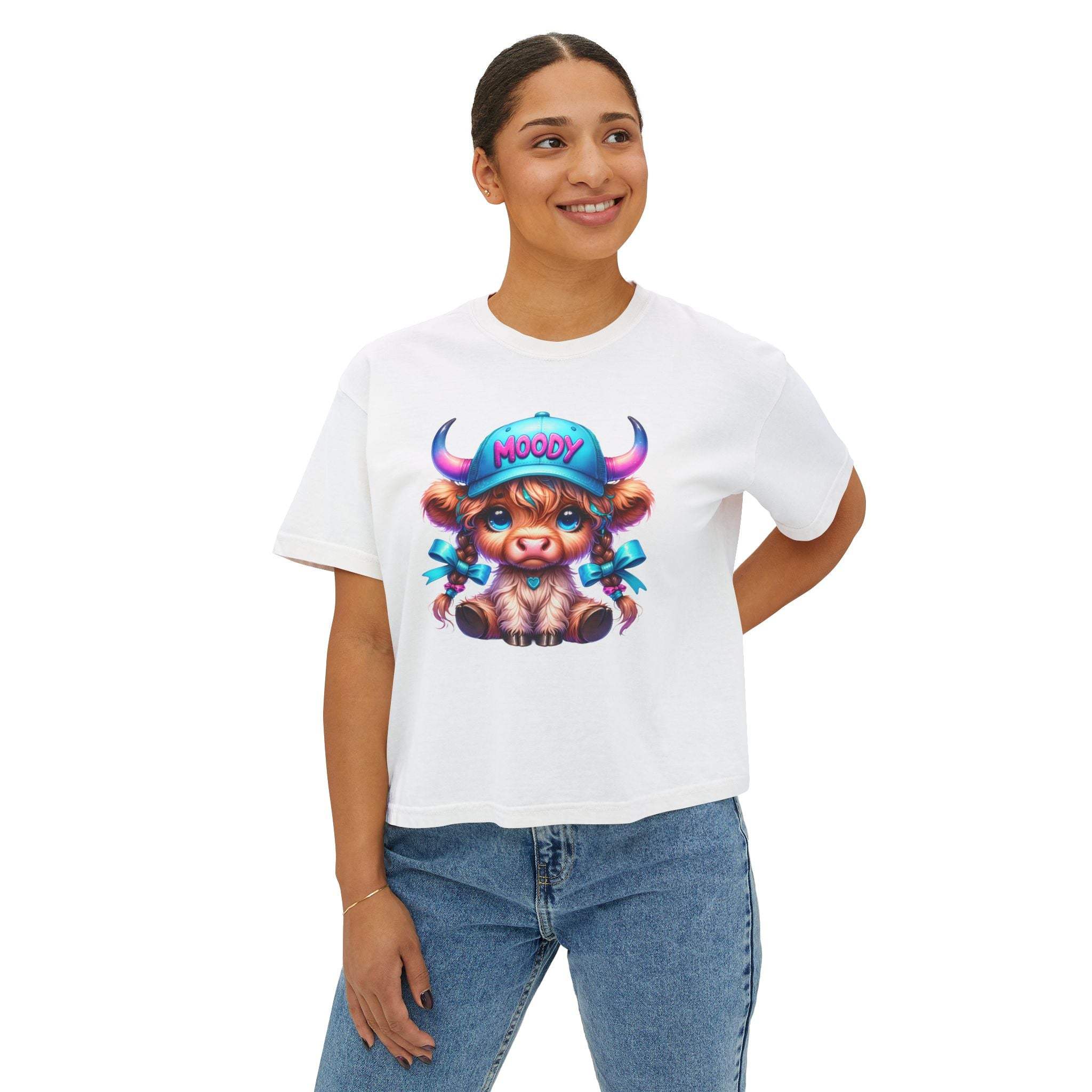 Women's white boxy tee featuring a moody girl Highland cow graphic, casual fit, and vintage pigment dye look