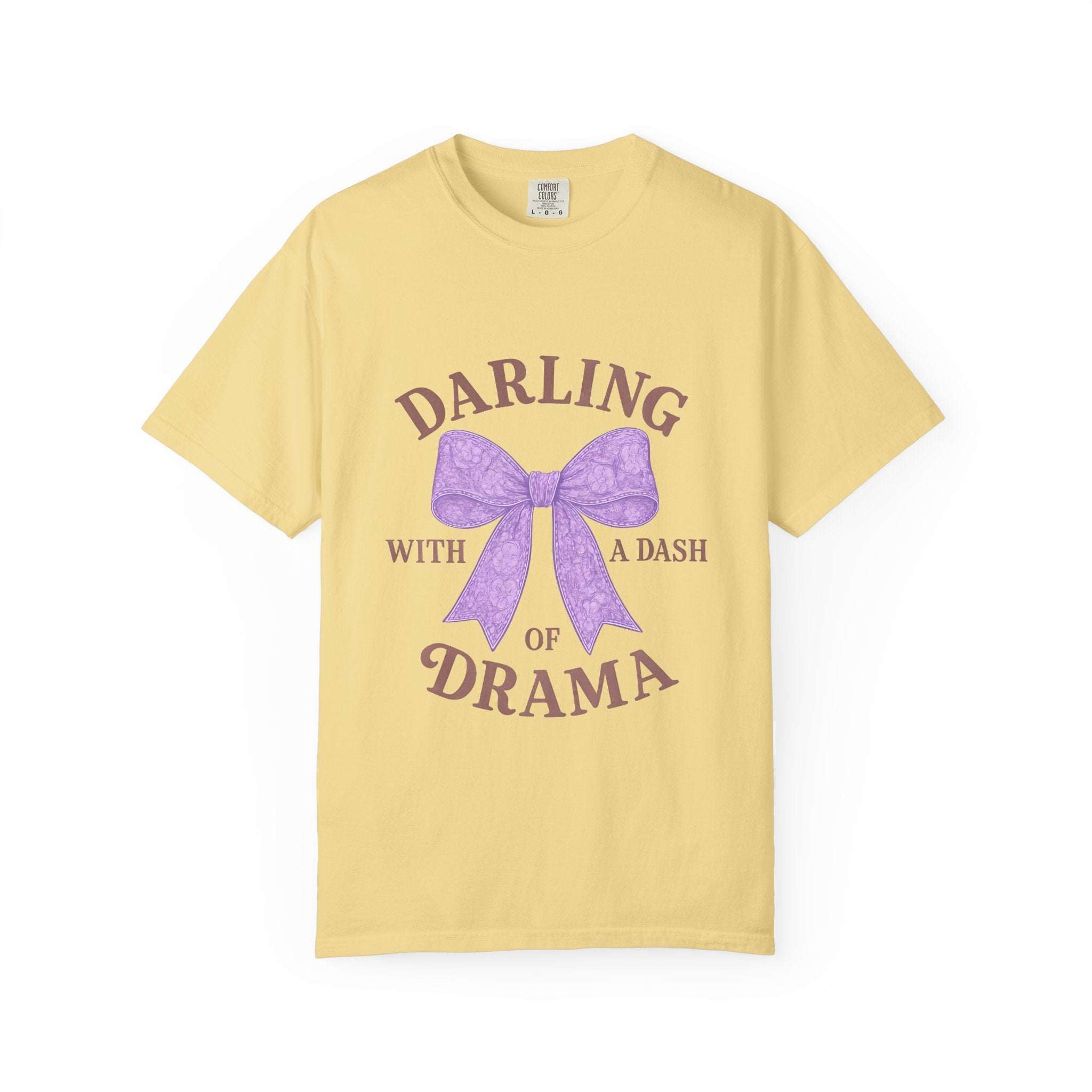 Yellow t-shirt with purple bow and text on a white background