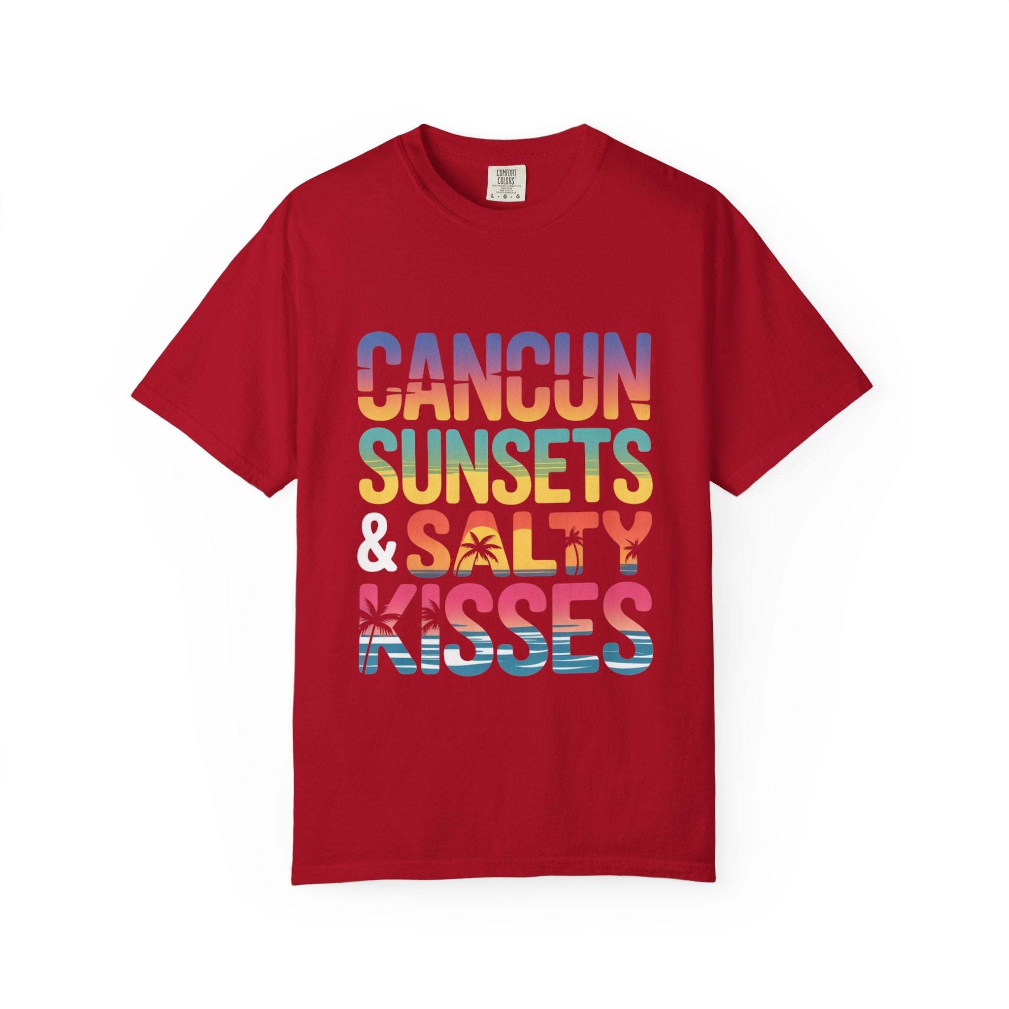 Red t-shirt with colorful text 'Cancun Sunsets & Salty Kisses' on a white background