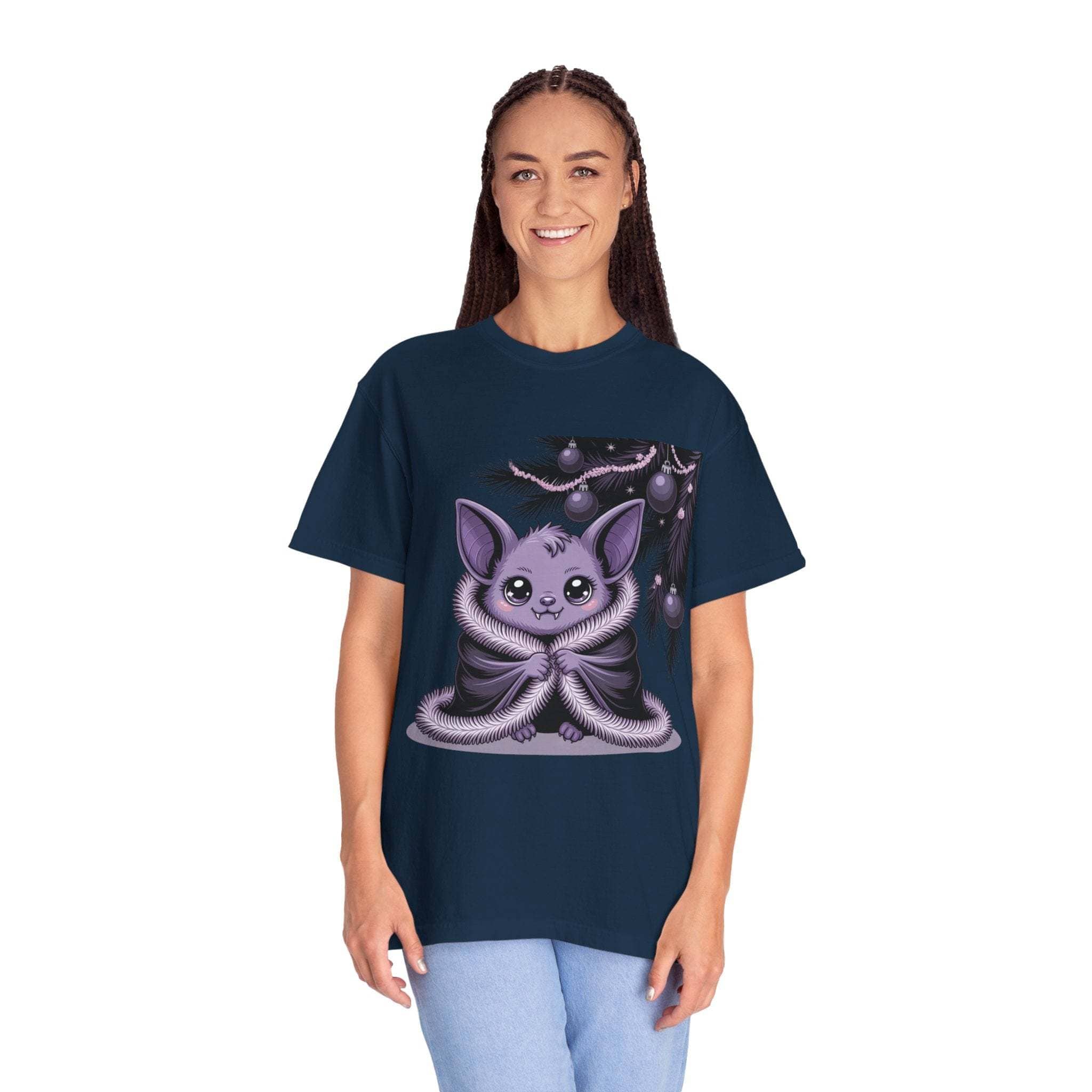 Person wearing a navy blue t-shirt with a cute creature design on a white background