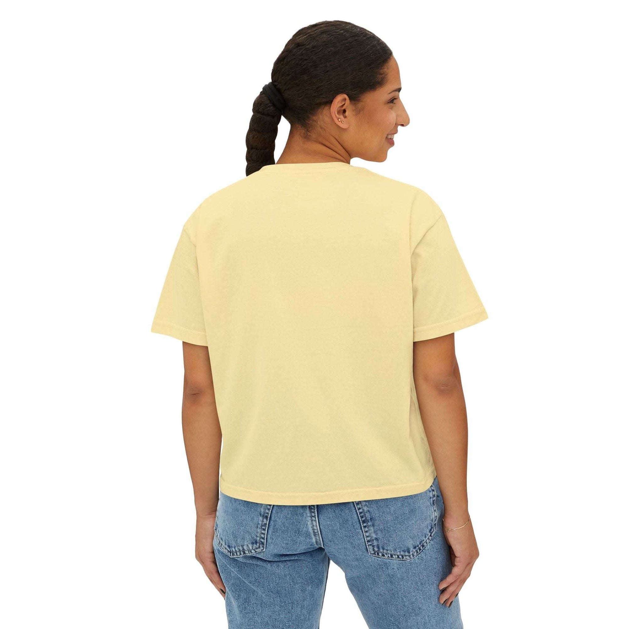 Woman wearing yellow boxy tee with casual boxy fit back view