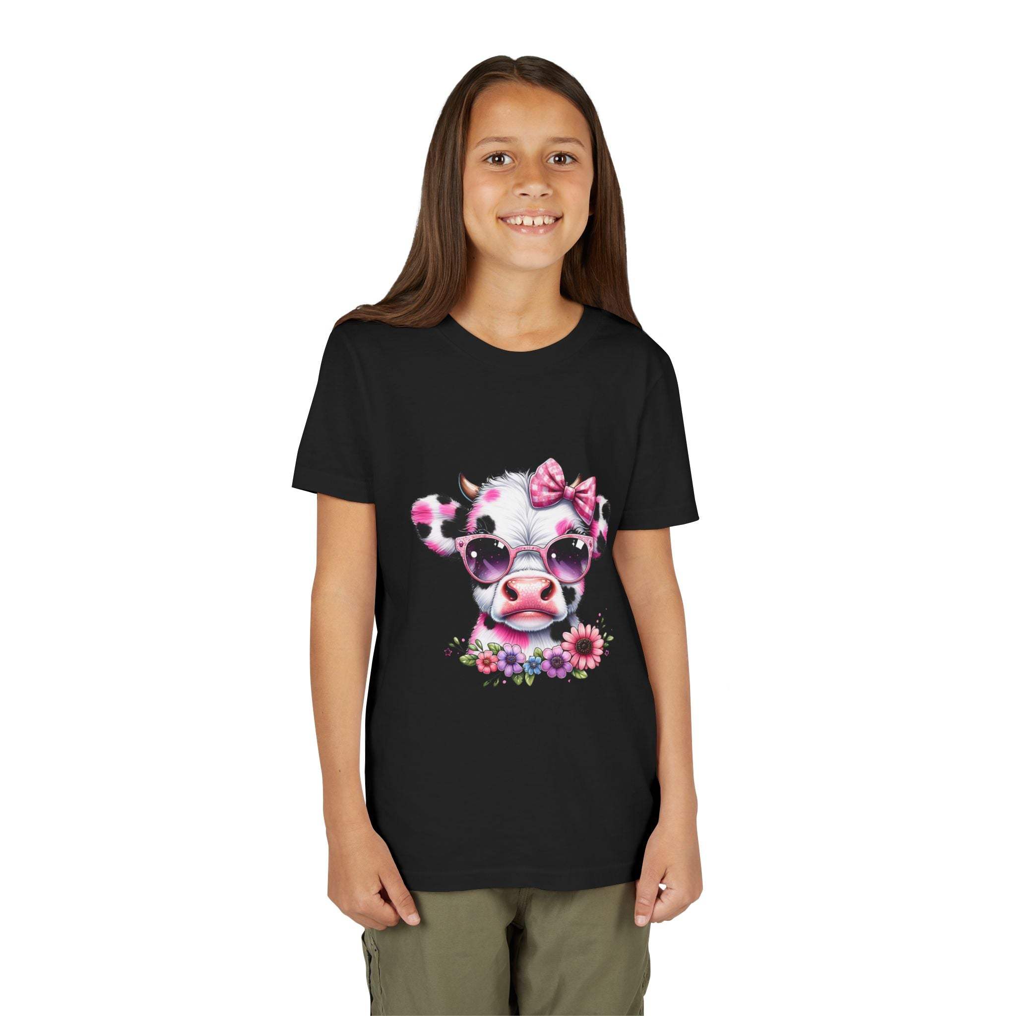 Girl wearing a black t-shirt with a cow design featuring sunglasses and a bow.