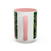 White mug with pink interior and handle, featuring a floral design on the side.