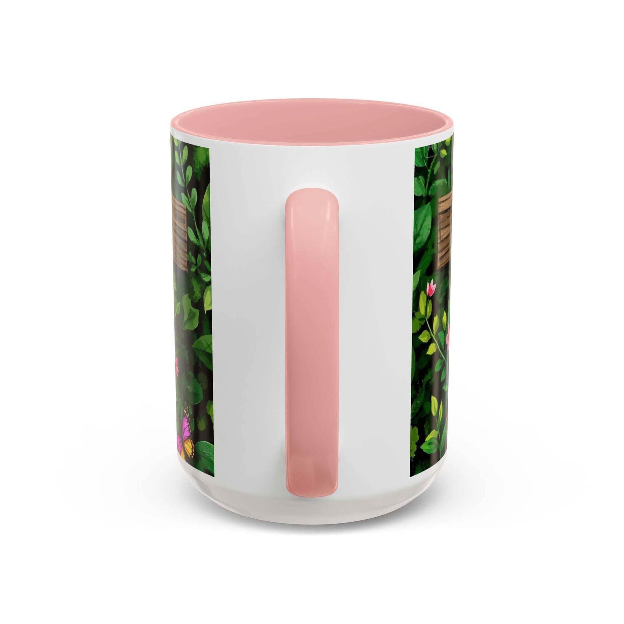 White mug with pink interior and handle, featuring a floral design on the side.