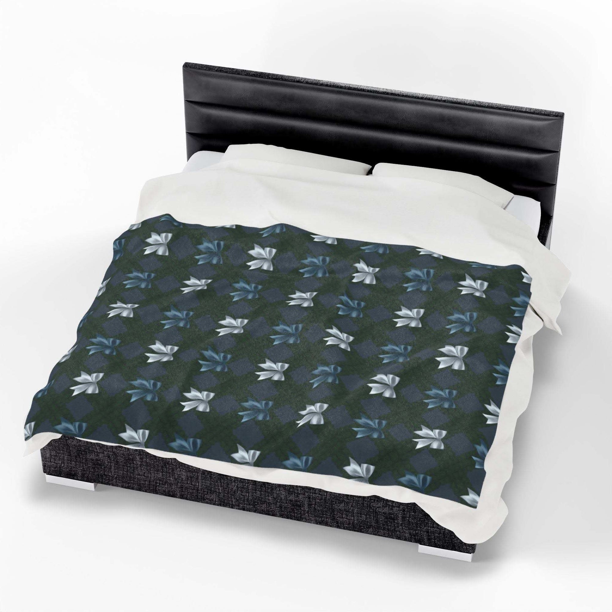 Velveteen plush blanket with winter coquette bows design on bed