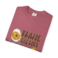 White cotton t-shirt featuring 'Praise the Lord, Devil the Eggs' design, perfect for Easter and Christian apparel.