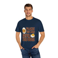 White cotton t-shirt featuring 'Praise the Lord, Devil the Eggs' design, perfect for Easter and Christian apparel.