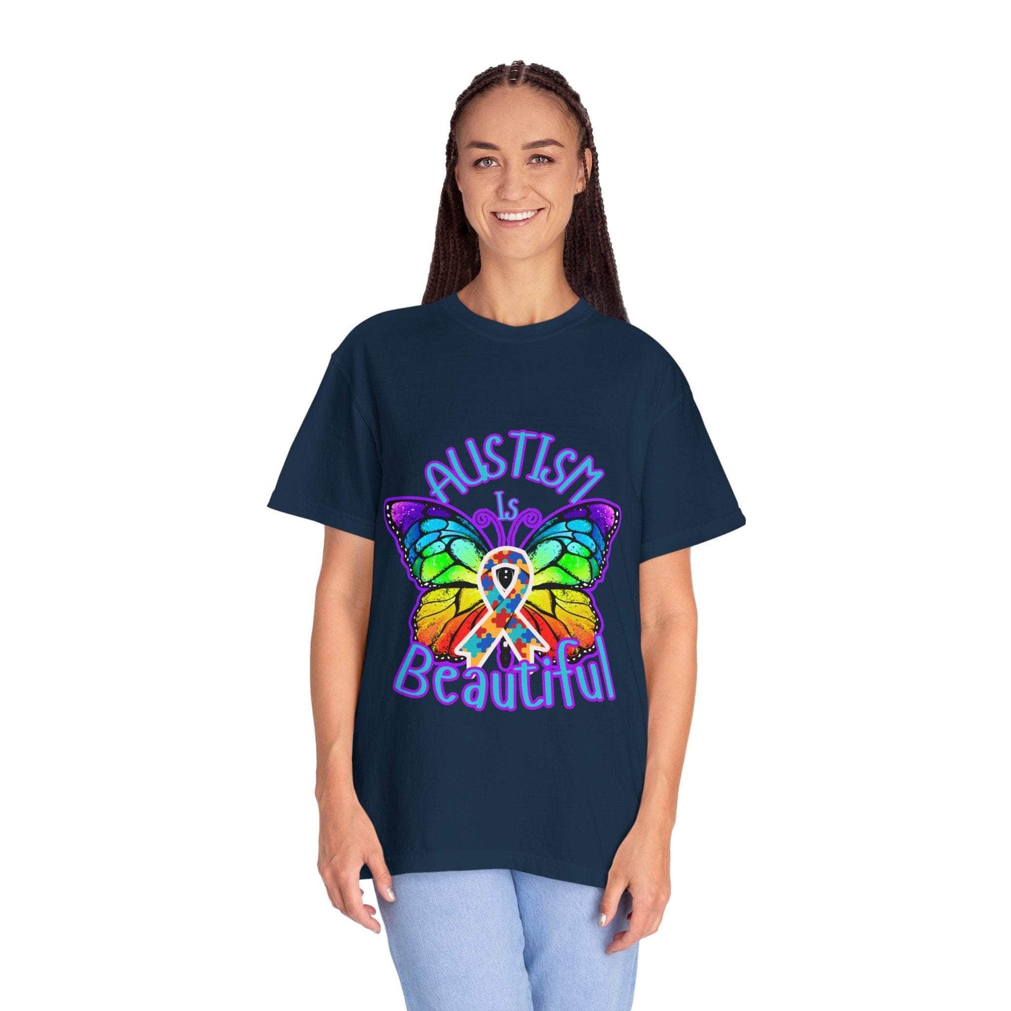 Woman wearing a navy Autism is Beautiful T-shirt with a colorful butterfly and autism awareness ribbon design