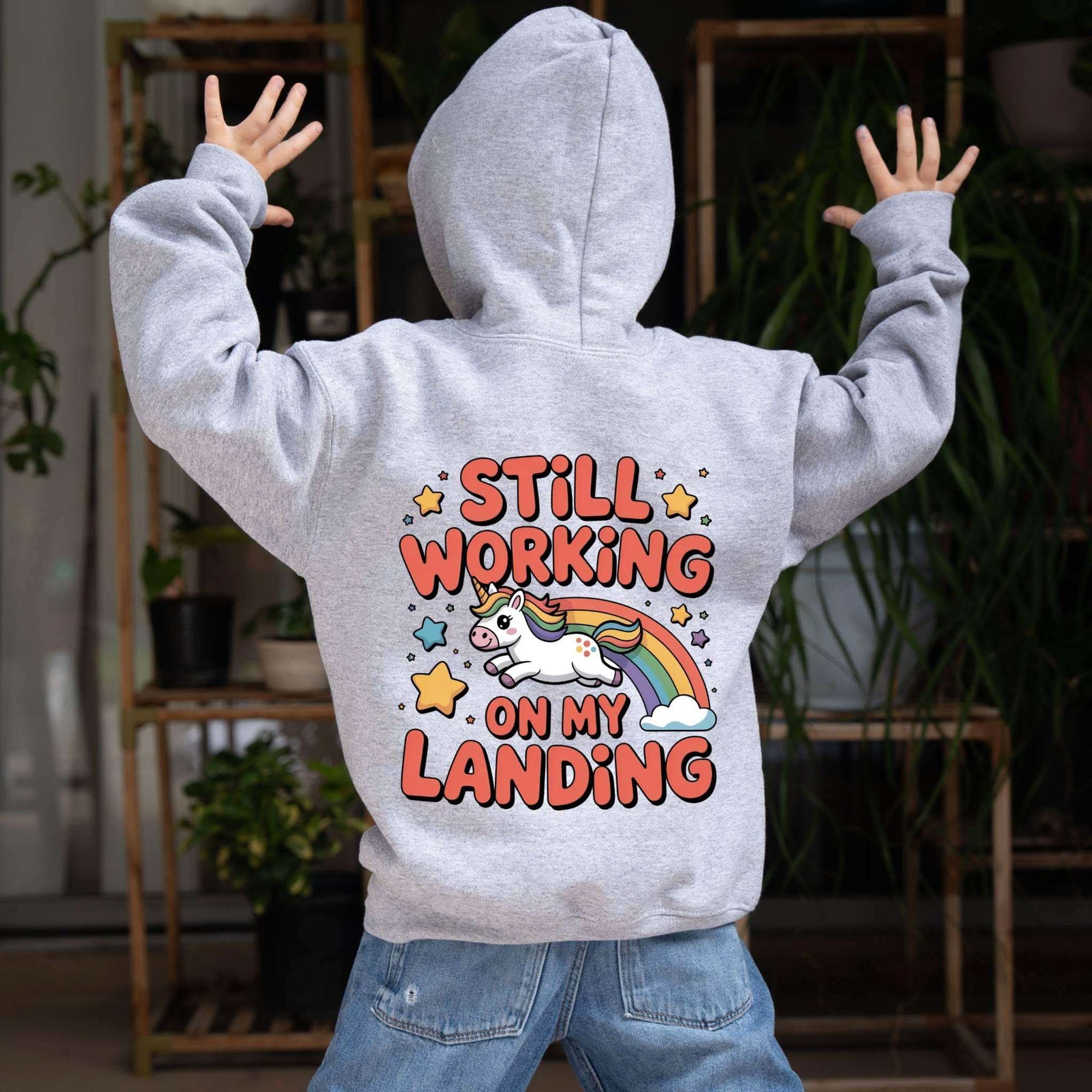 Kids hoodie with playful unicorn rainbow design and kangaroo pouch pocket