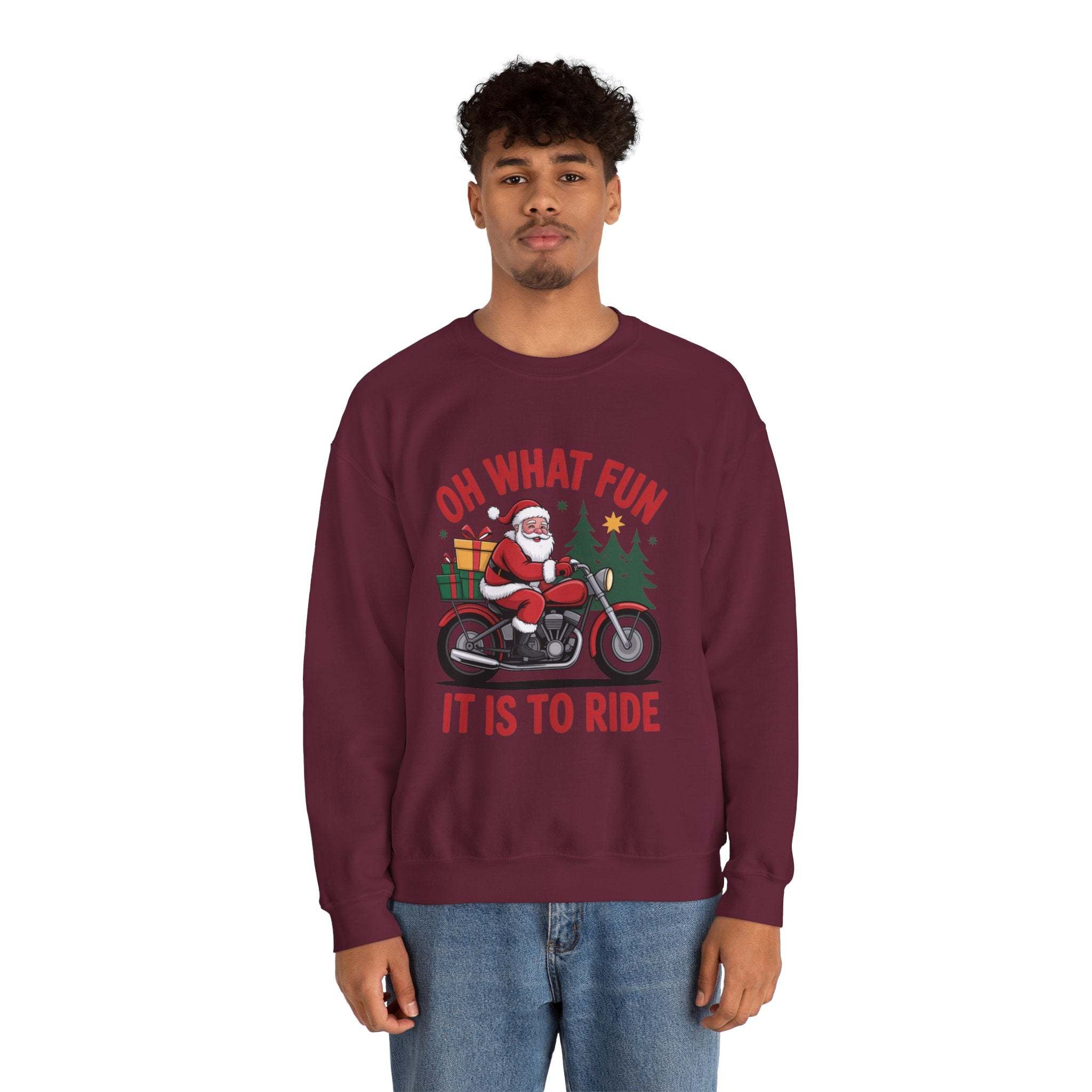 Man wearing navy Motorcycle Santa Sweatshirt with Santa on motorcycle and holiday gifts design in festive setting