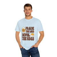 White cotton t-shirt featuring 'Praise the Lord, Devil the Eggs' design, perfect for Easter and Christian apparel.
