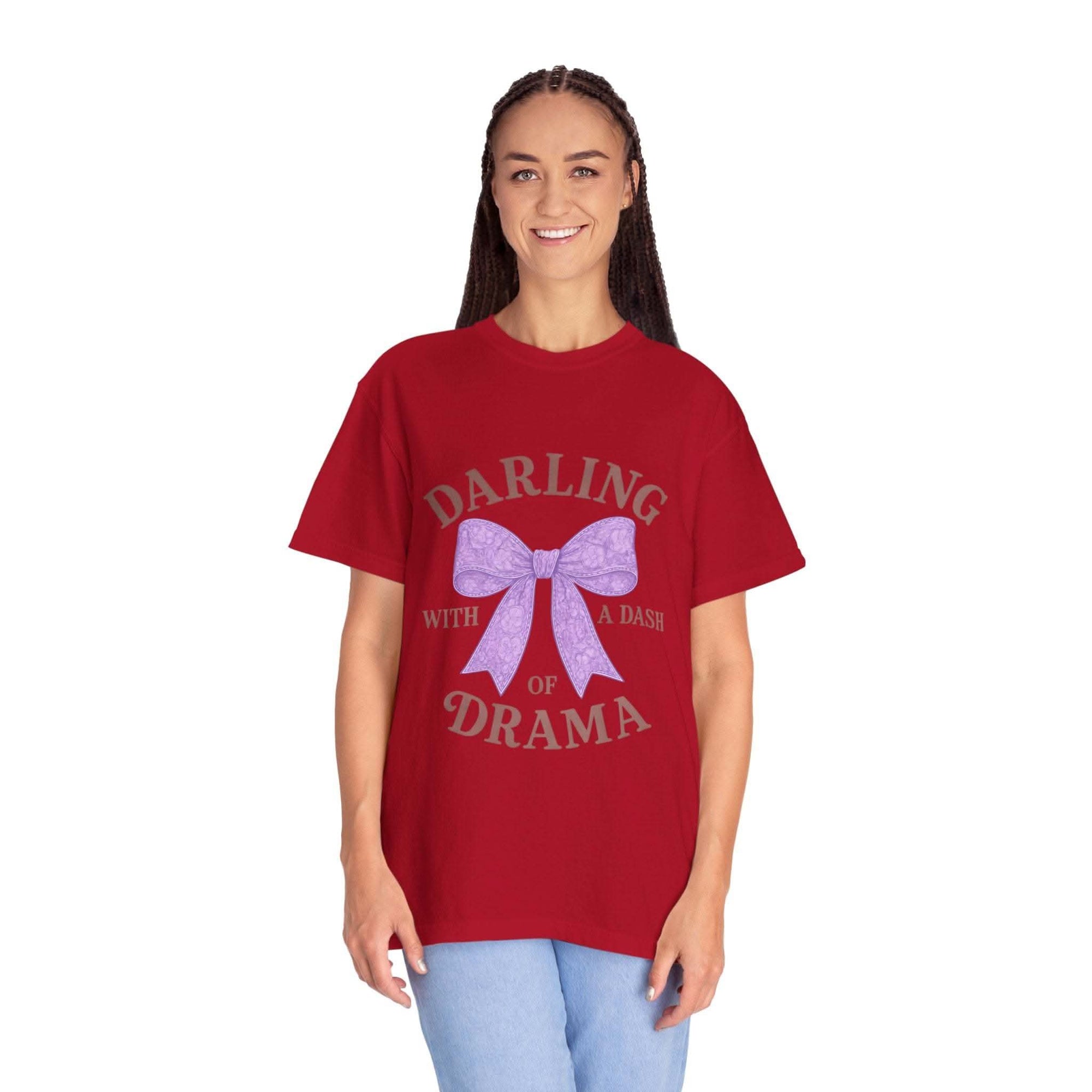 Woman wearing a red t-shirt with a graphic and text on a white background