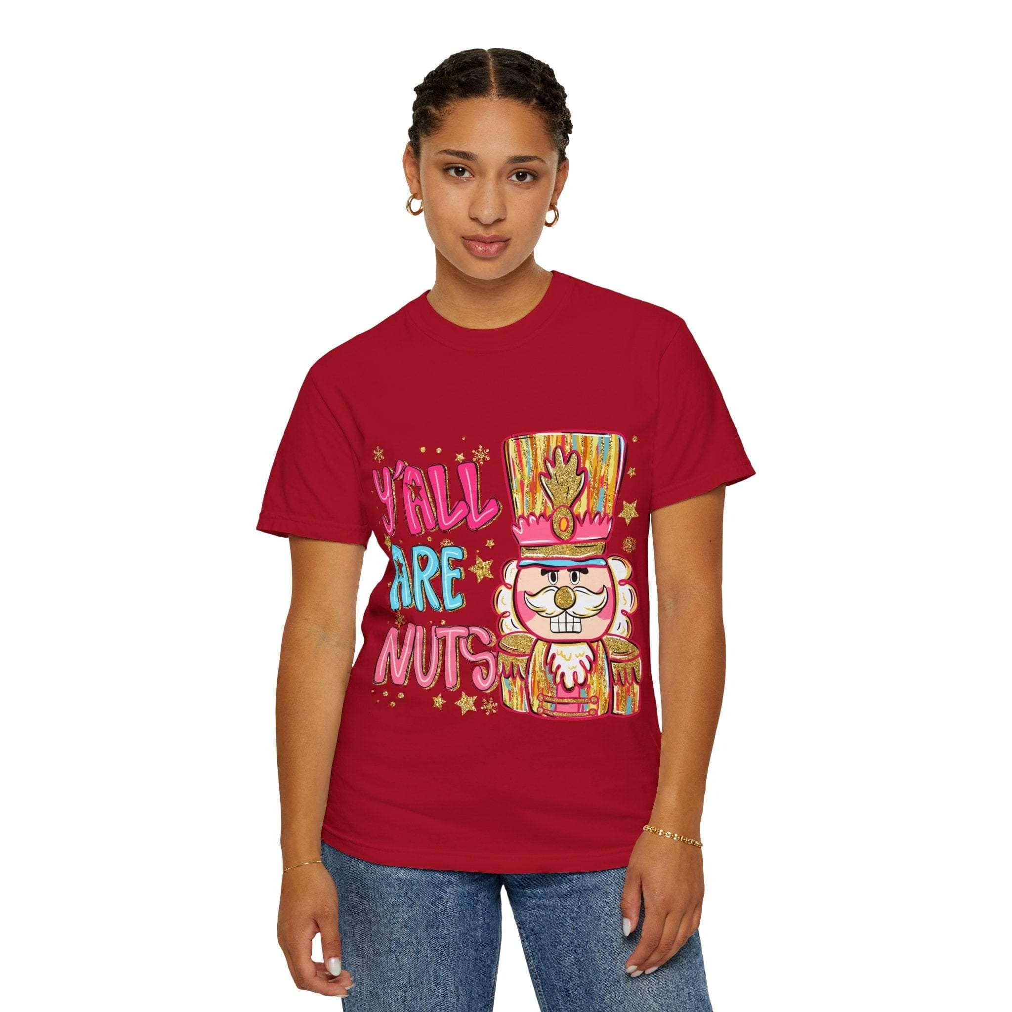 woman wearing red Yall Are Nuts Nutcracker t-shirt with colorful nutcracker graphic and festive design
