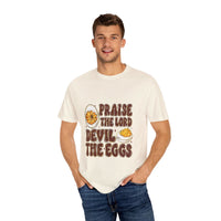 White cotton t-shirt featuring 'Praise the Lord, Devil the Eggs' design, perfect for Easter and Christian apparel.