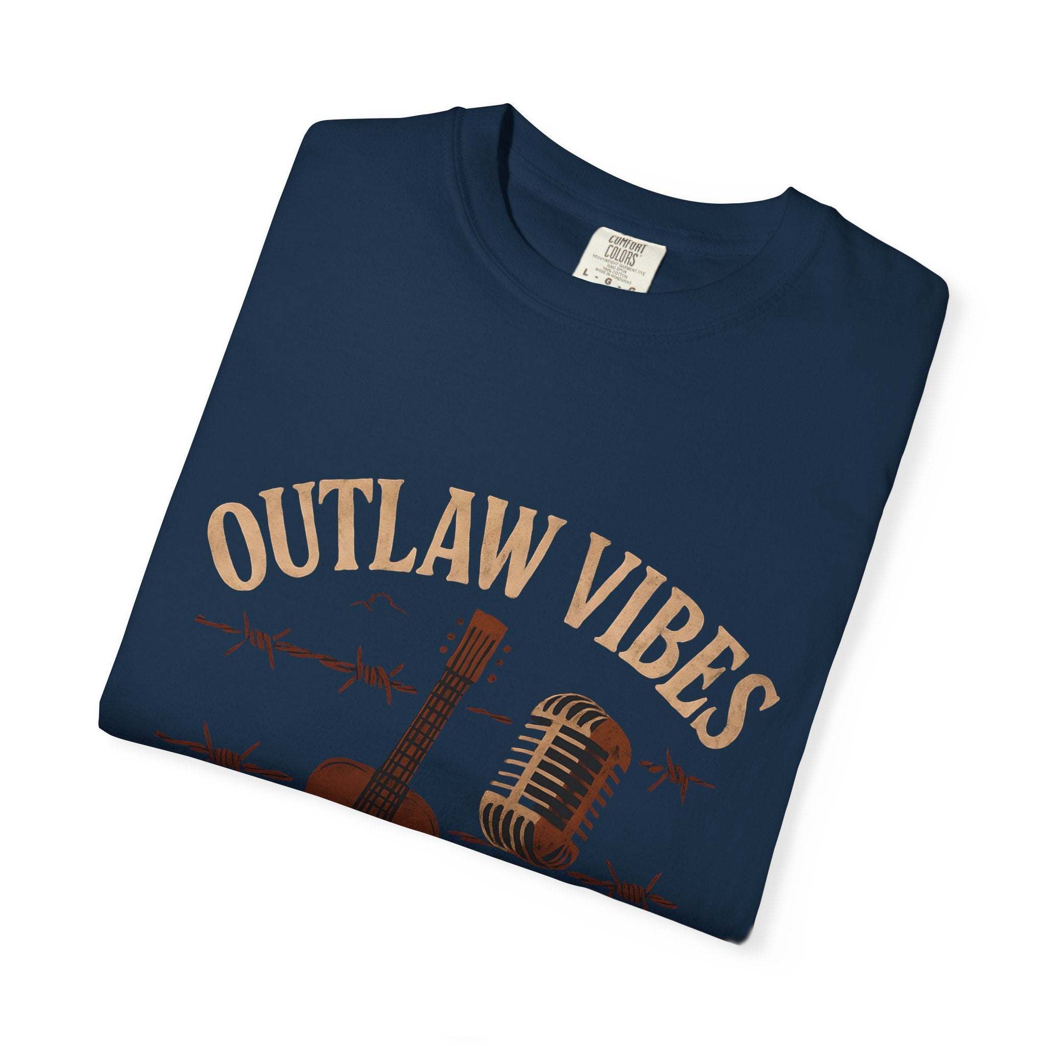 Folded navy blue t-shirt with 'Outlaw Vibes' text and graphics on a white background