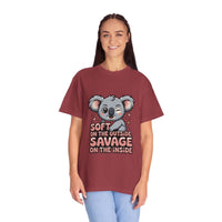 Woman wearing maroon t-shirt with playful koala graphic and "Soft on the Outside, Savage on the Inside" text