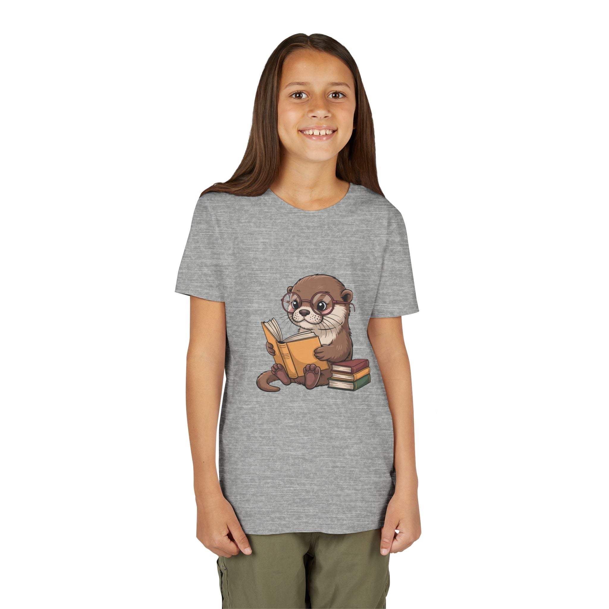 Girl wearing a gray t-shirt with an otter holding books graphic on a white background
