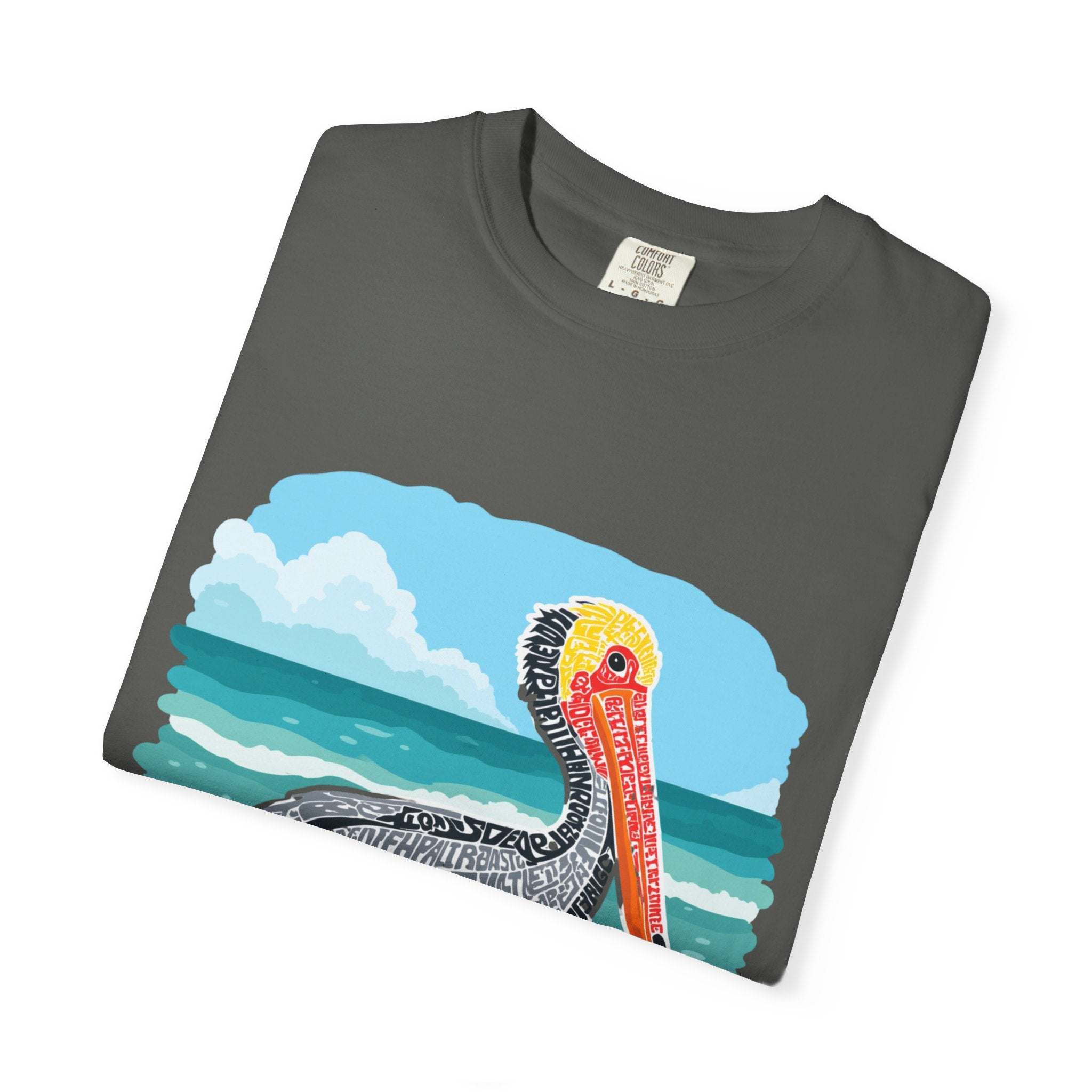 Folded gray t-shirt with a colorful graphic design on a white background