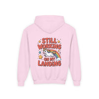 Kids unicorn rainbow design hoodie with playful unicorn and rainbow graphic, soft white fabric, and kangaroo pocket.