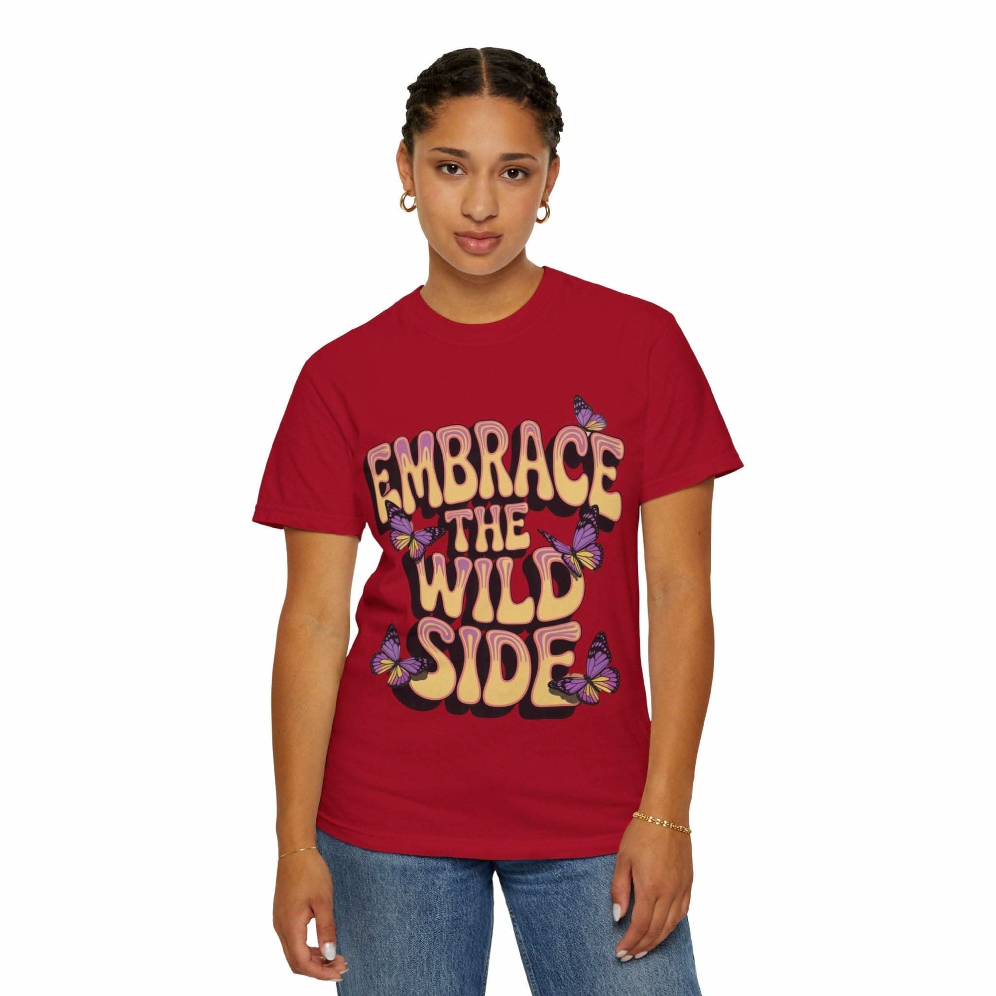 Unisex garment-dyed T-shirt in red with "Embrace the Wild Side" print and butterfly design, made of soft 100% ring-spun cotton.